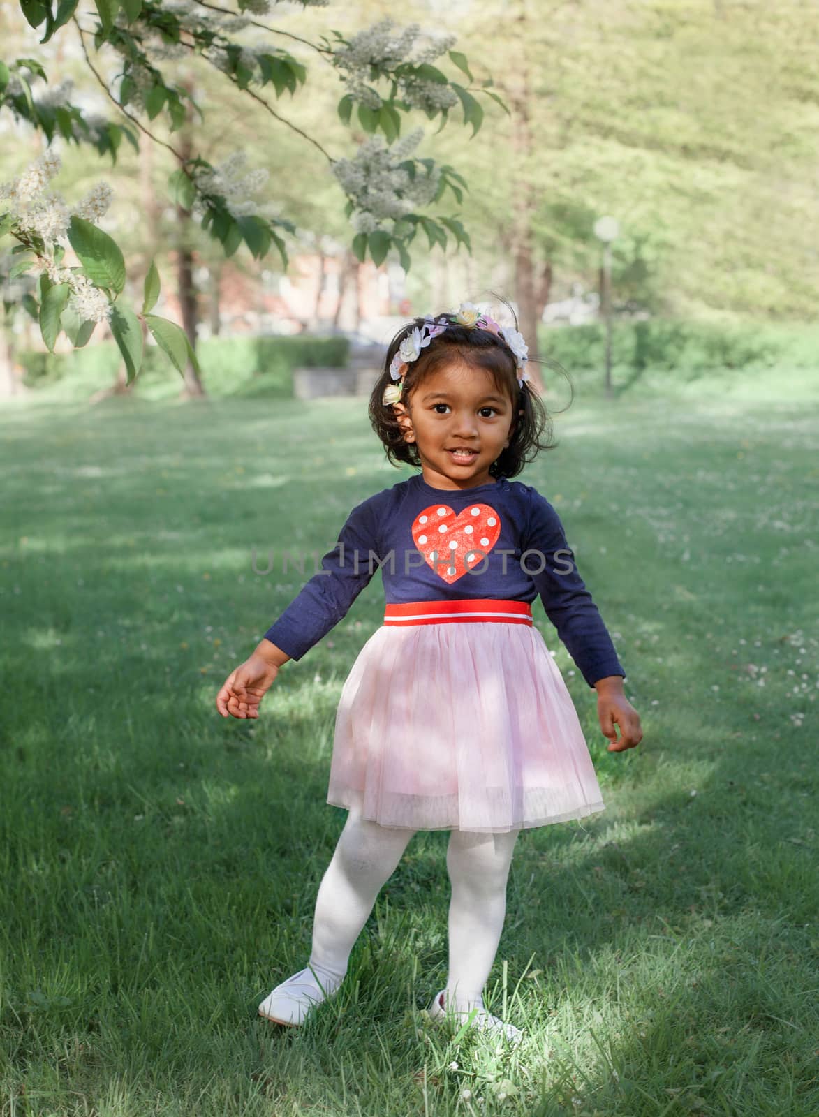 happy little Asian girl in summer Park