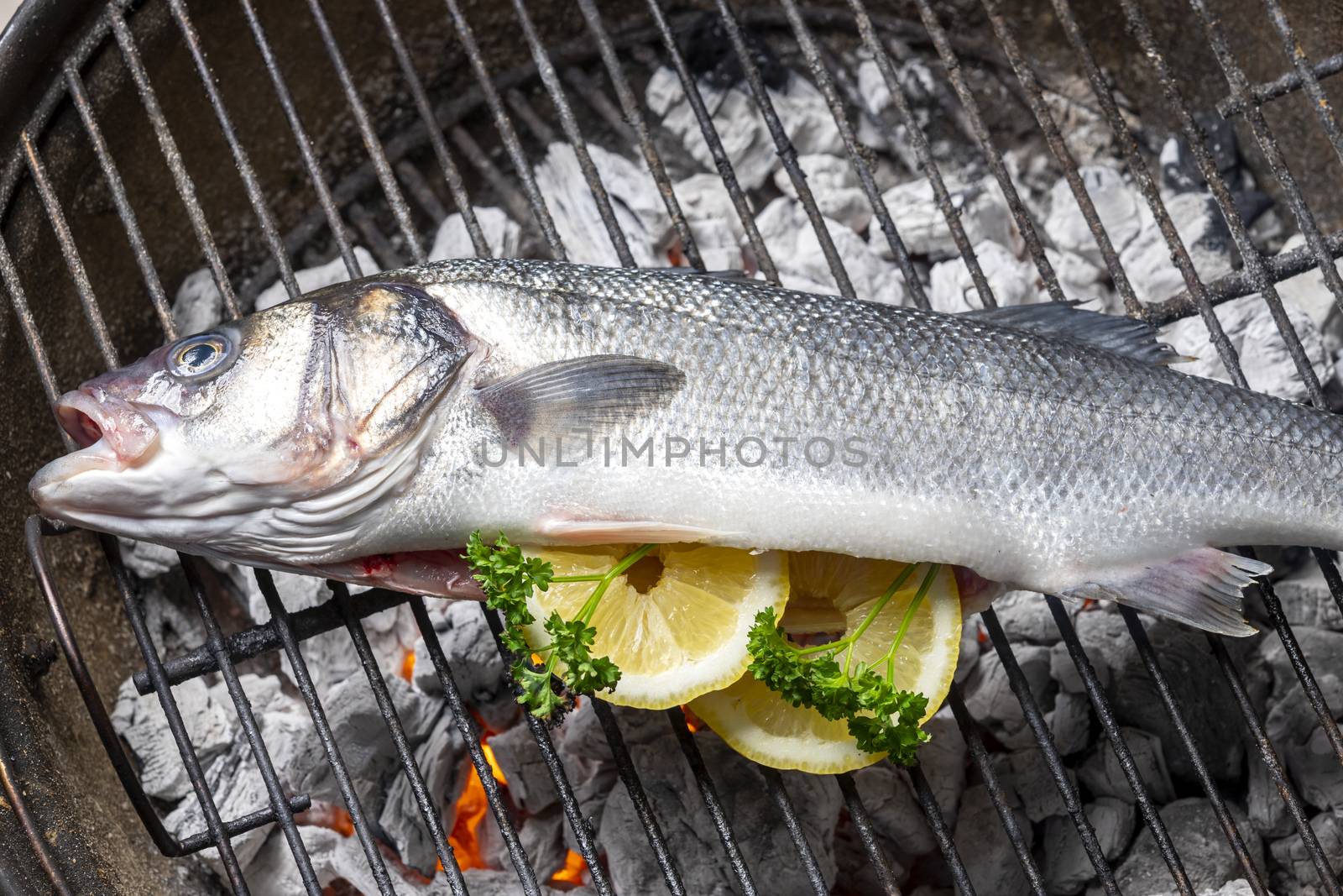 bass with lemon on the bbq