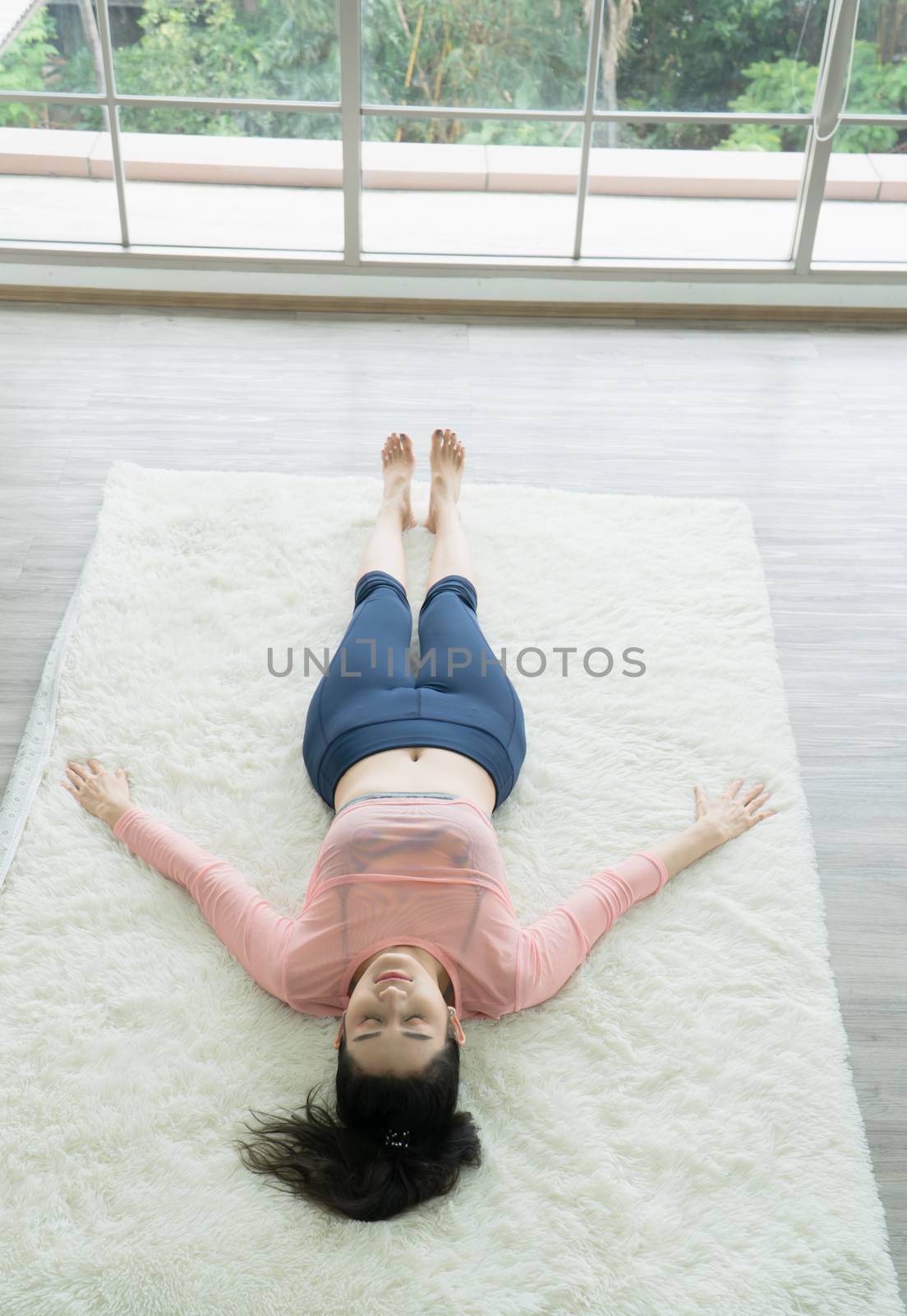 Attractive and healthy woman Asian are exercising Stretching with yoga postures at home helps to balance life.