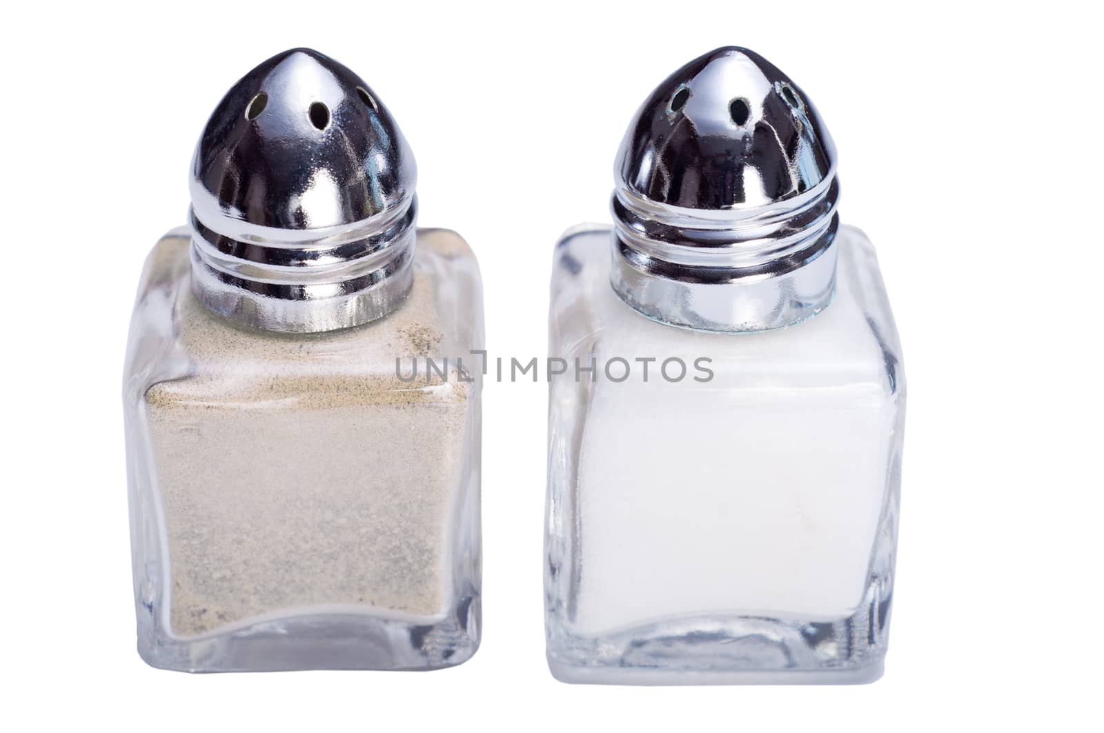 Closeup photograph of small silver and glass salt and pepper cellars