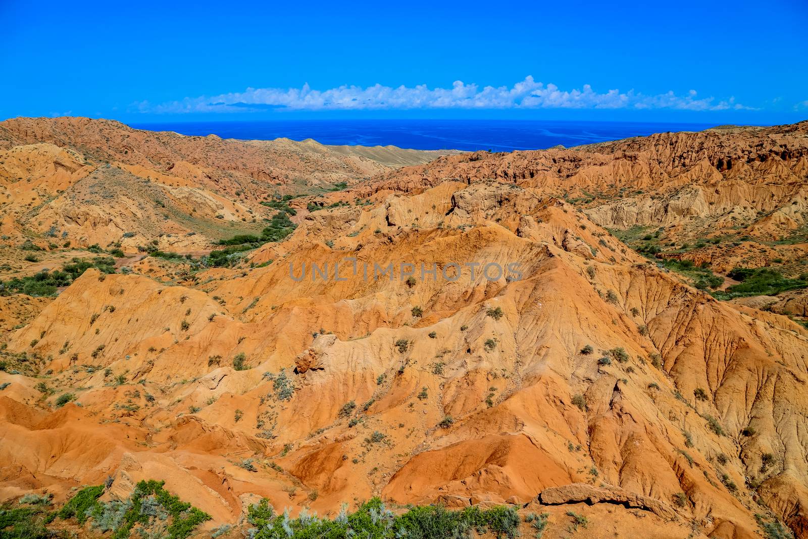 Red sandstone rock formations Seven bulls and Broken heart, Jeti Oguz canyon in Kyrgyzstan, Issyk-Kul region, Central Asia