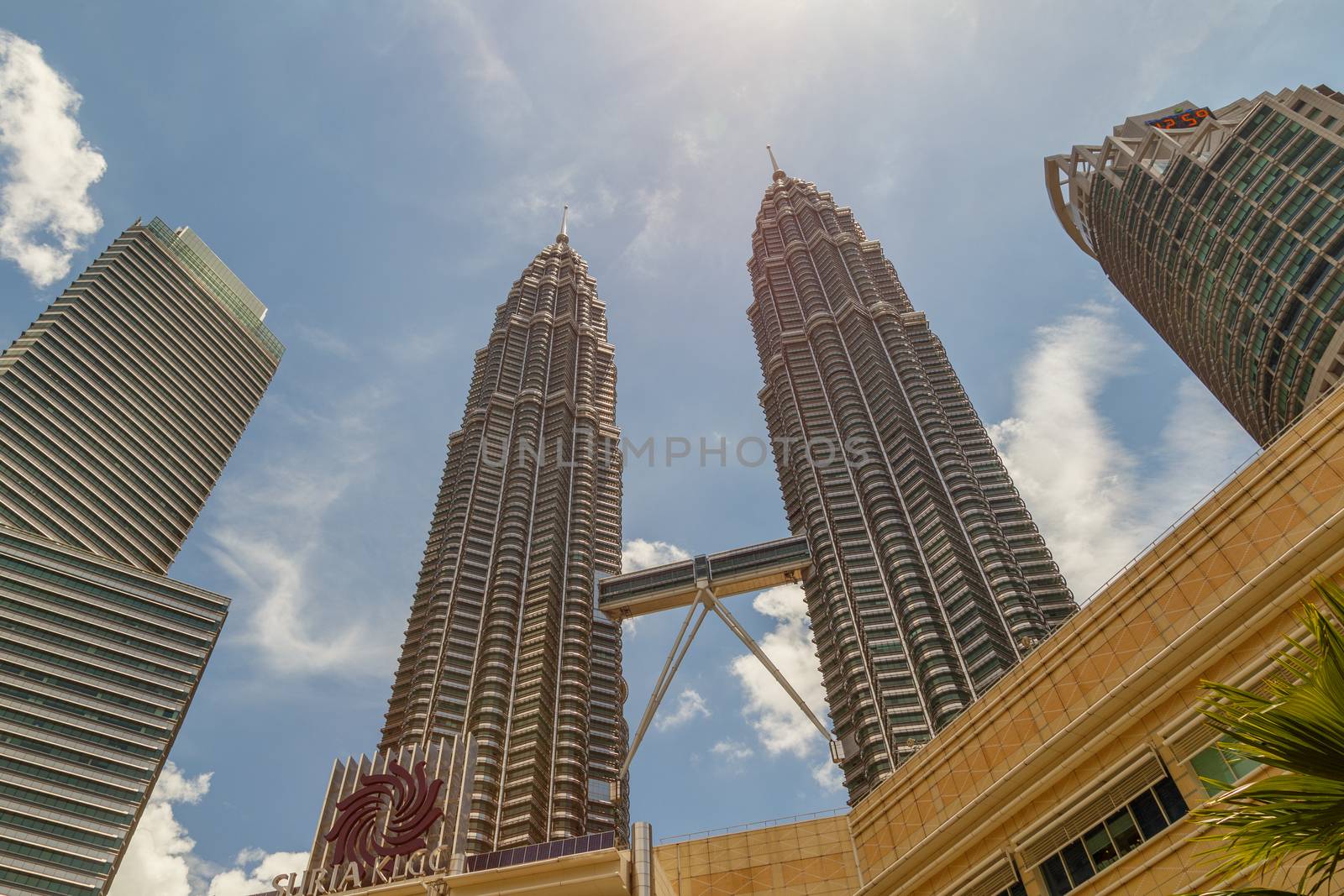 Kuala Lumpur, Malaysia - CIRCA 2017: view of KLCC or Petronas Towers, also known as the Petronas Twin Towers are twin skyscrapers in Kuala Lumpur. by dugulan