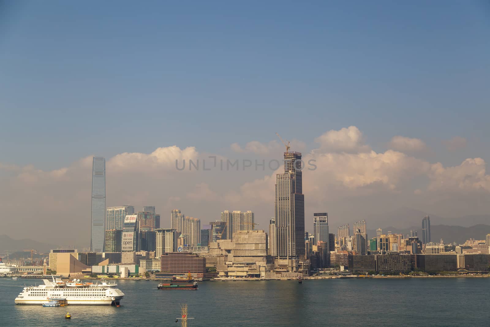 HONG KONG, CHINA - CIRCA 2020: Hong Kong Skyline and Victoria Harbor in morning. Sunset over Hong Kong bay on a clear day by dugulan