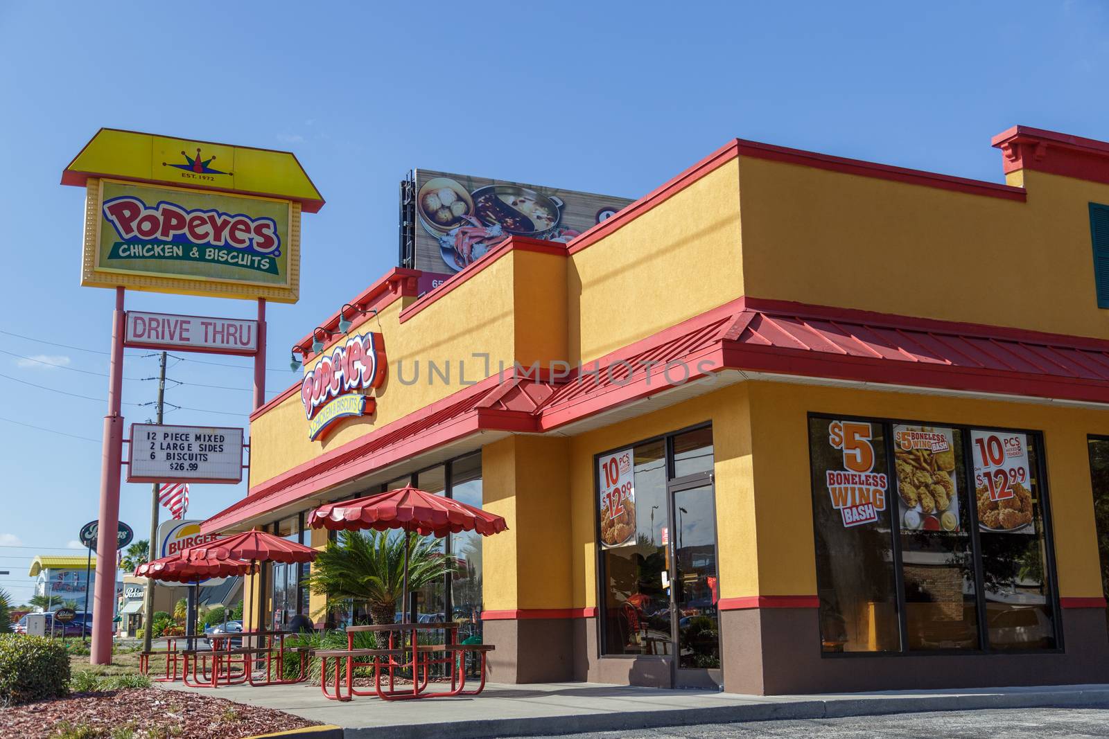 Orlando, Florida, USA - CIRCA, 2019: Popeyes restaurant building, which served fried chicken and New Orleans style cuisine for years, now adds a traditional chicken sandwich to the menu.