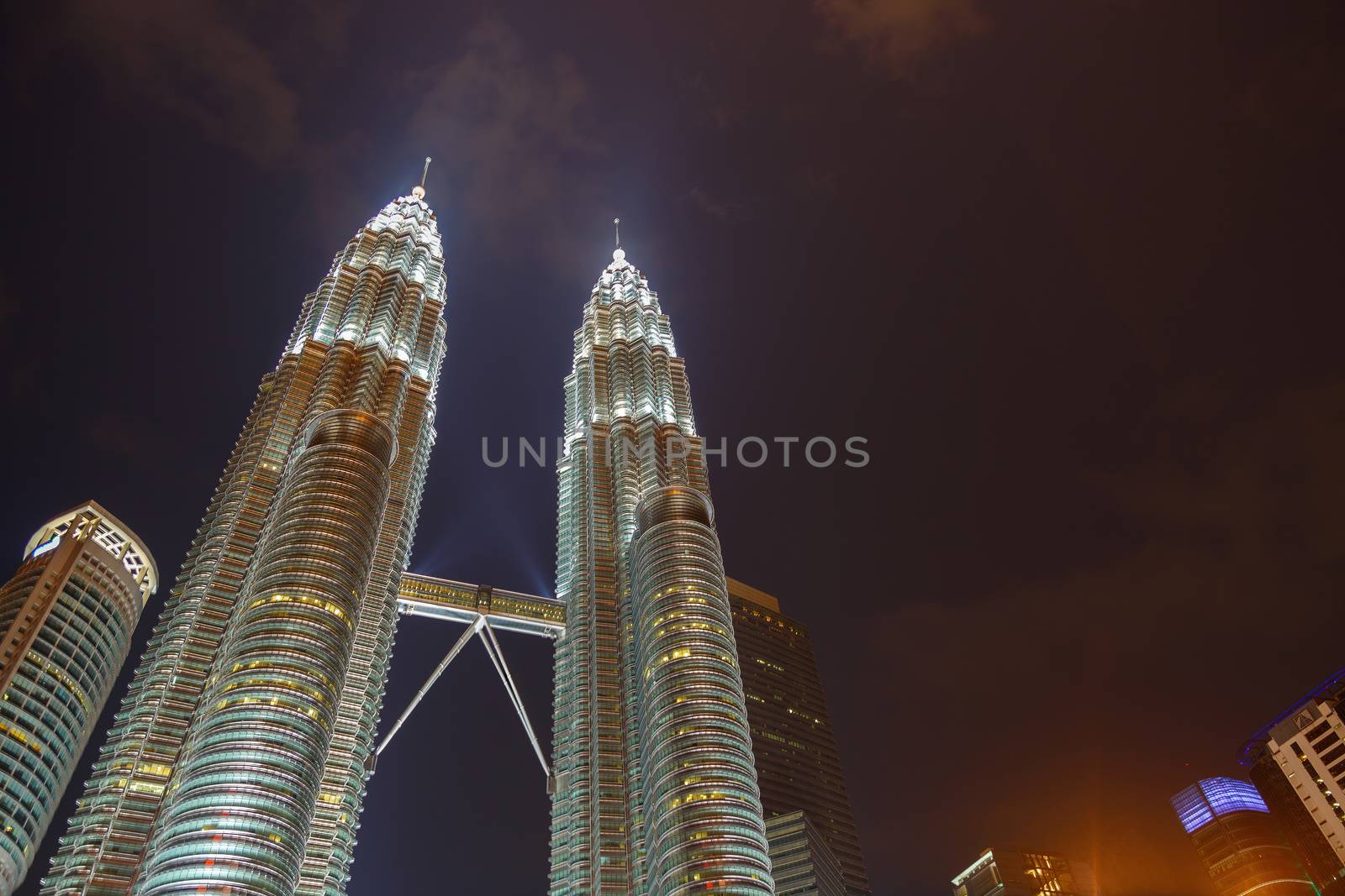 Kuala Lumpur, Malaysia - CIRCA 2017: Night view of KLCC or Petronas Towers, also known as the Petronas Twin Towers are twin skyscrapers in Kuala Lumpur.