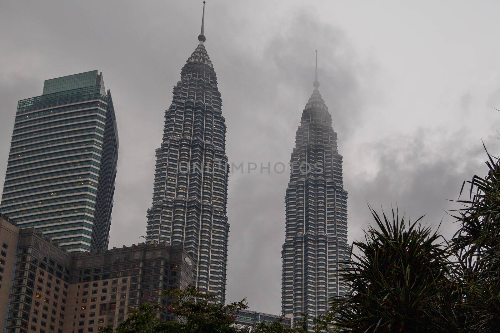 Kuala Lumpur, Malaysia - CIRCA 2017: view of KLCC or Petronas Towers, also known as the Petronas Twin Towers are twin skyscrapers in Kuala Lumpur. by dugulan