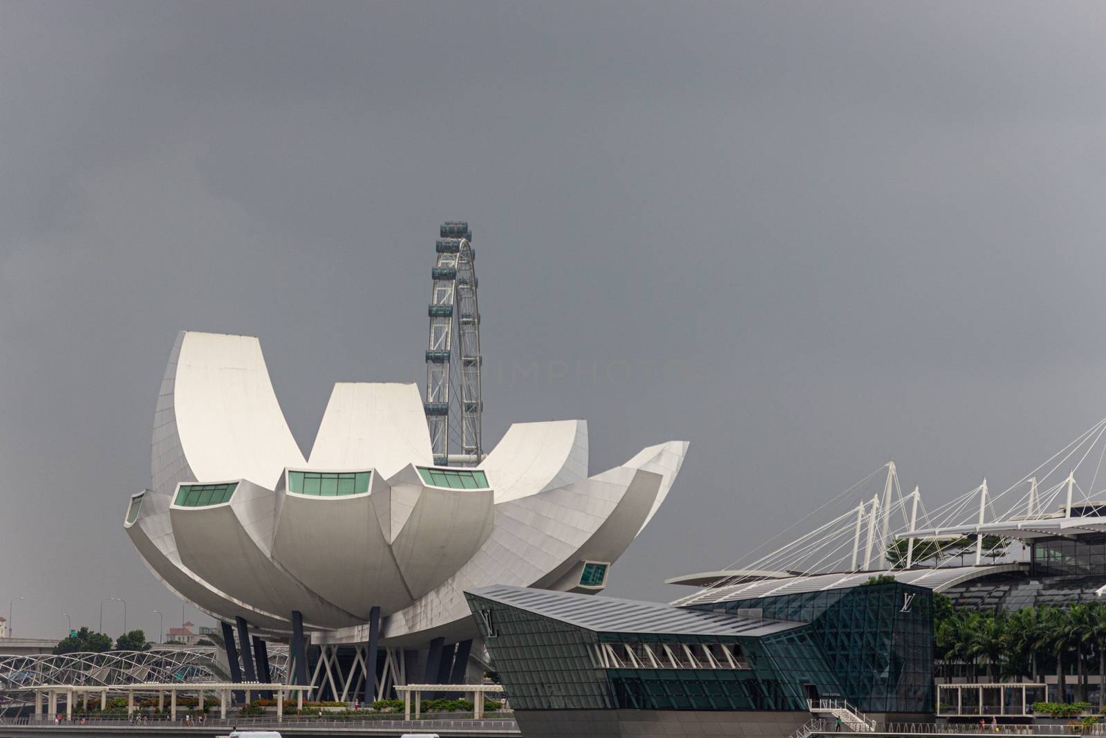 Singapore - CIRCA 2020: View of Art Museum and Singapore Flyer during the day with a stormy sky on the background.