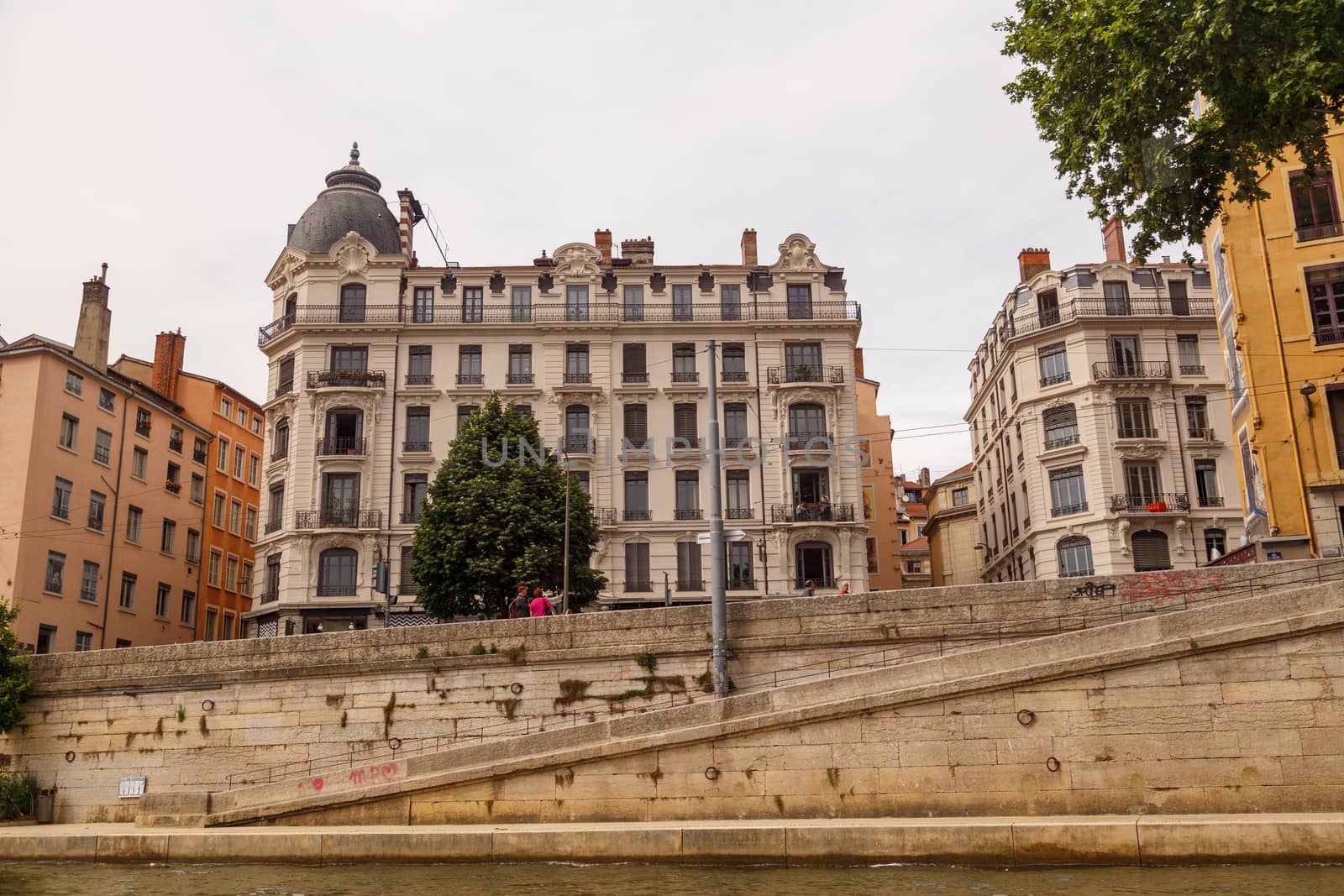 Lyon, France - CIRCA 2019: Picturesque historical Lyon Old Town buildings on the bank of Saone River. Lyon, Region Auvergne-Rhone-Alpes, France.