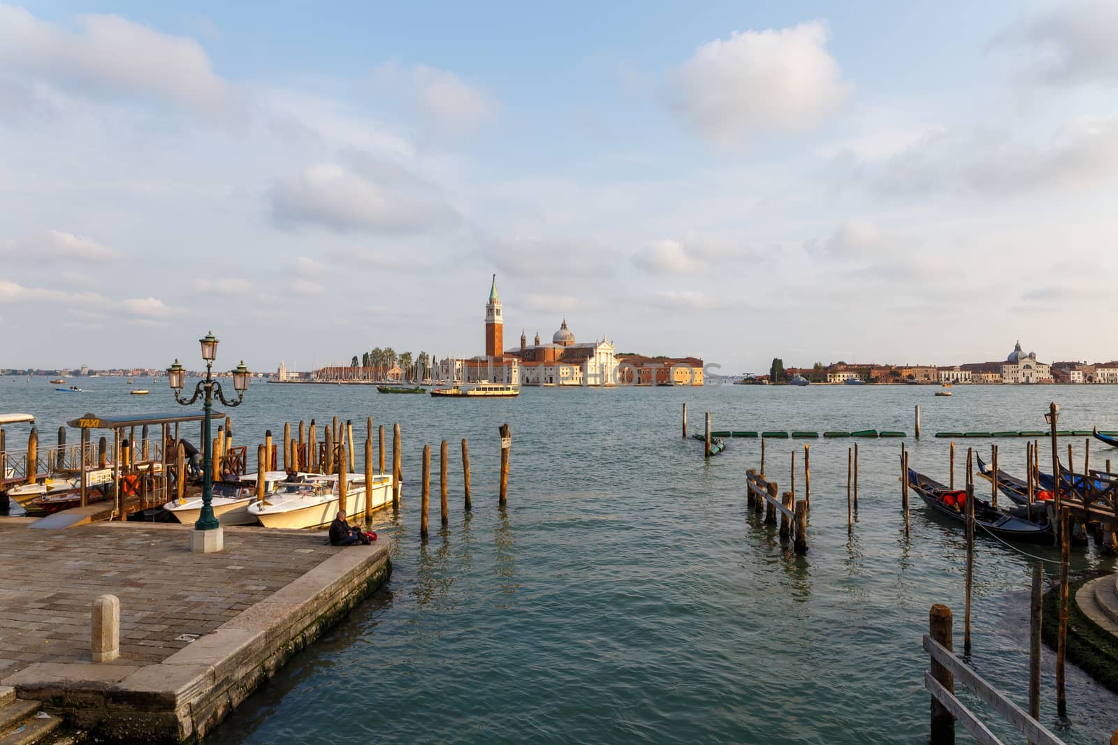 Venice, Italy - CIRCA 2020: View of an empty water canal in Venice Italy. Concept of the effects of lock down due to CoronaVirus COVID-19. Picturesque landscape. by dugulan