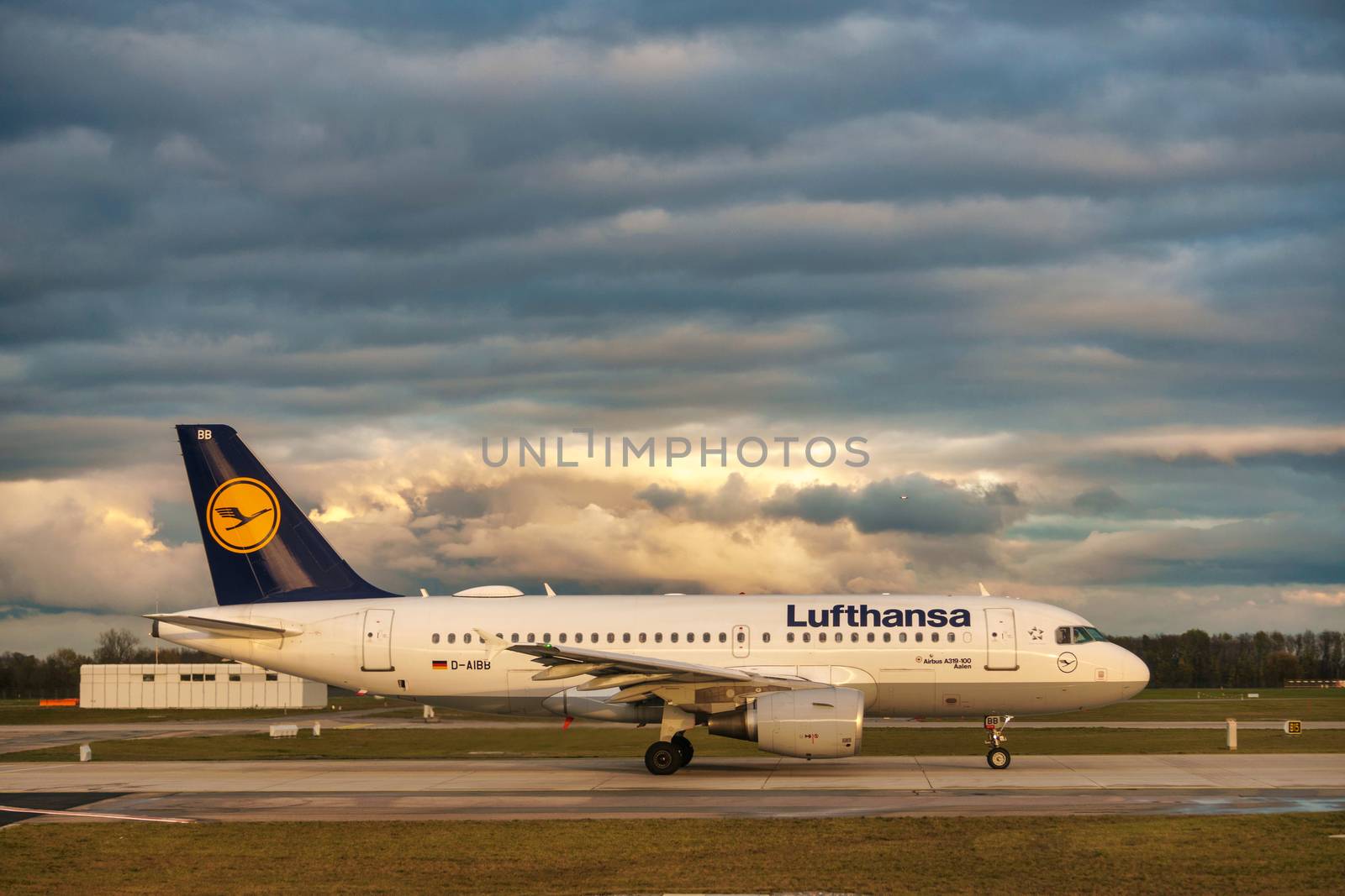 GERMANY, MUNICH - CIRCA 2020: Lufthansa Airline Airplane getting ready for landing or take off at Munich airport with dramatic sky in the background. Travel during coronavirus pandemic concept