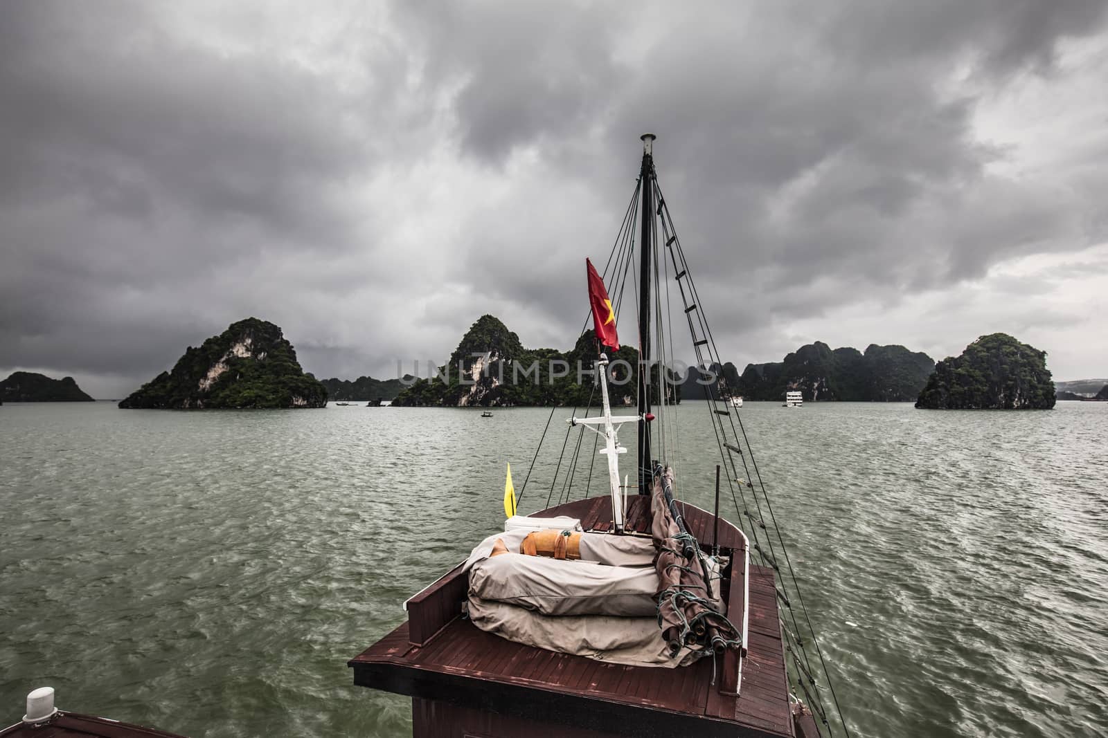 View throughout the islands of Ha Long Bay on a stormy summer's day in Ha Long Bay, Vietnam