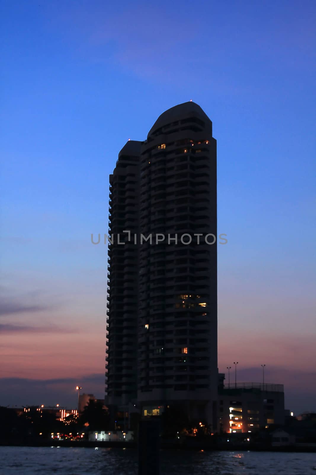 The silhouette of the black building Riverside Chao Phraya River, Thailand