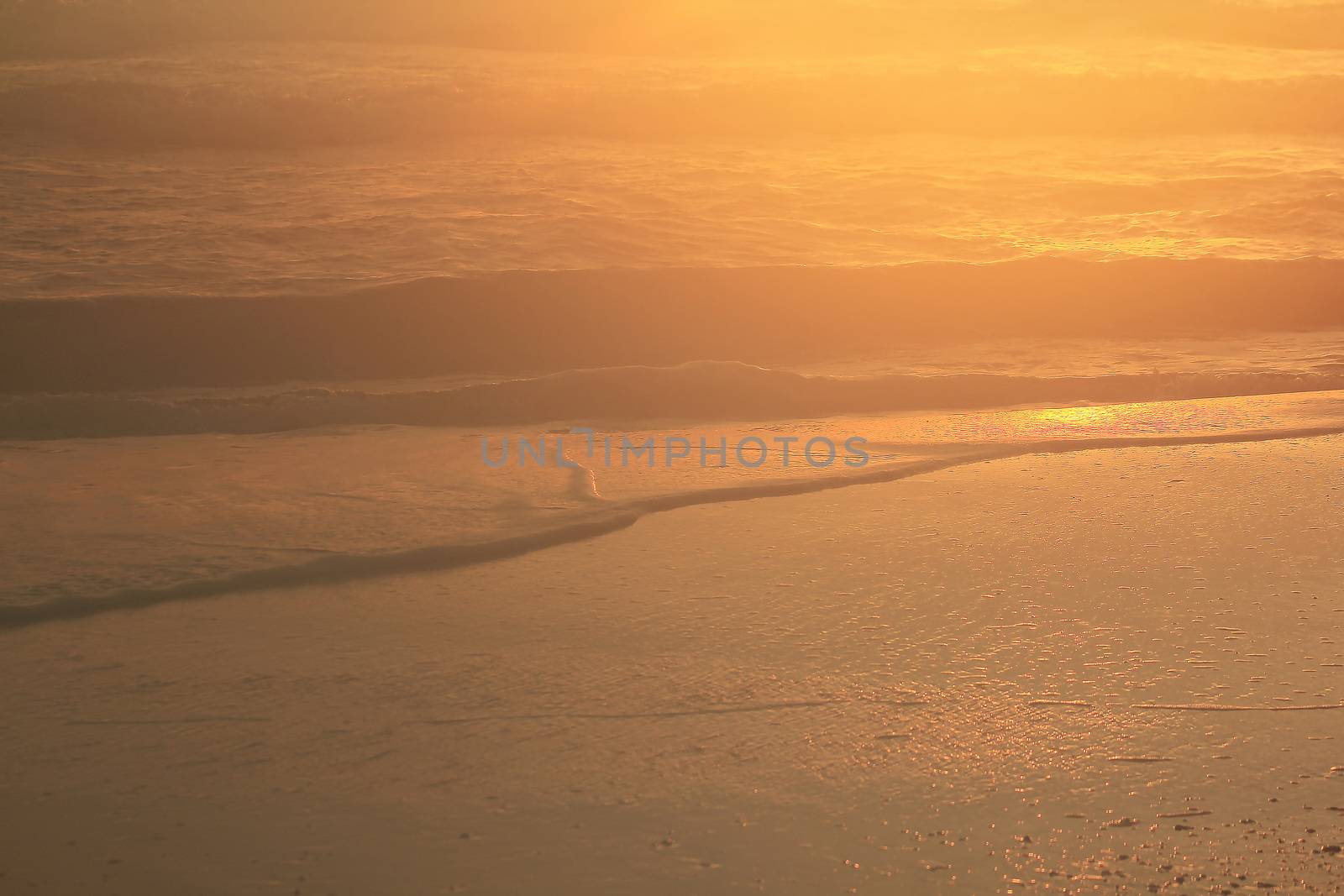 The morning sunrise reflects the sea water.