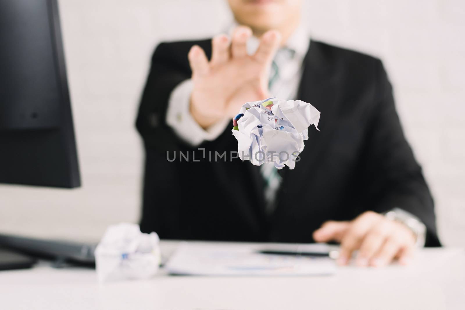 businessman emotions and fail concept crumpled paper on table with, unhappy no idea to thinking throwing papers in office
