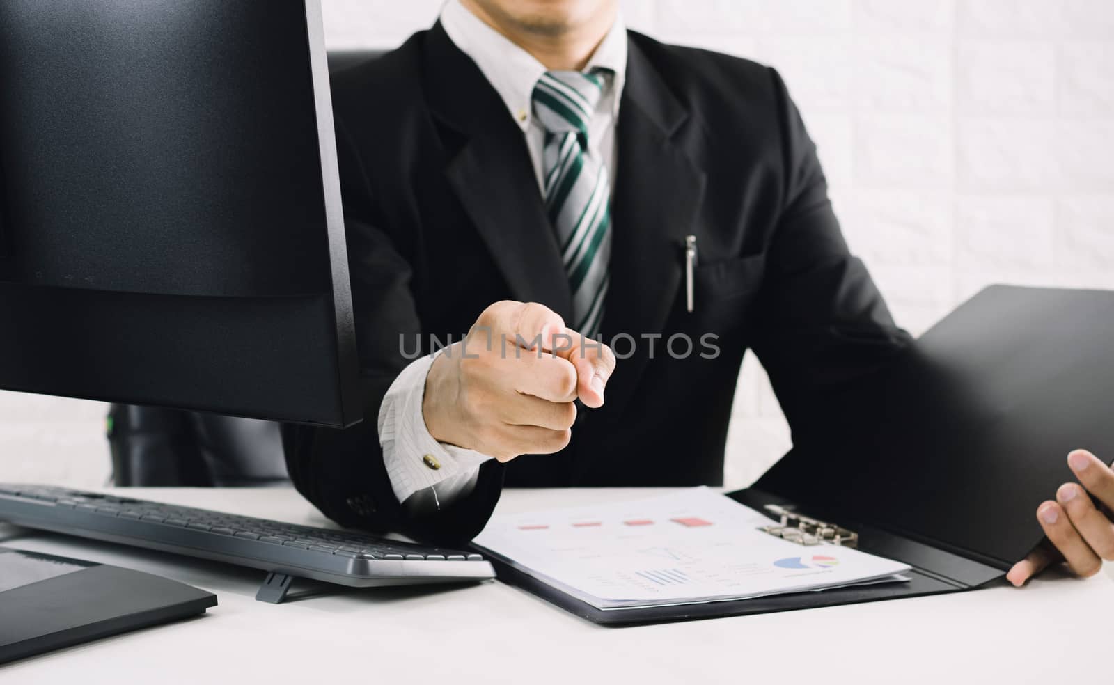 The boss business men pointing the finger on the desk 
