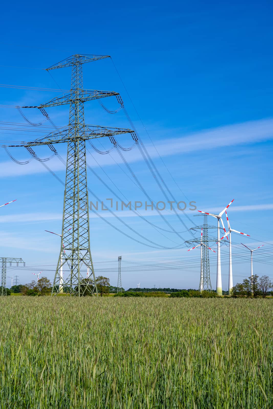Overhead power lines and wind turbines seen in Germany