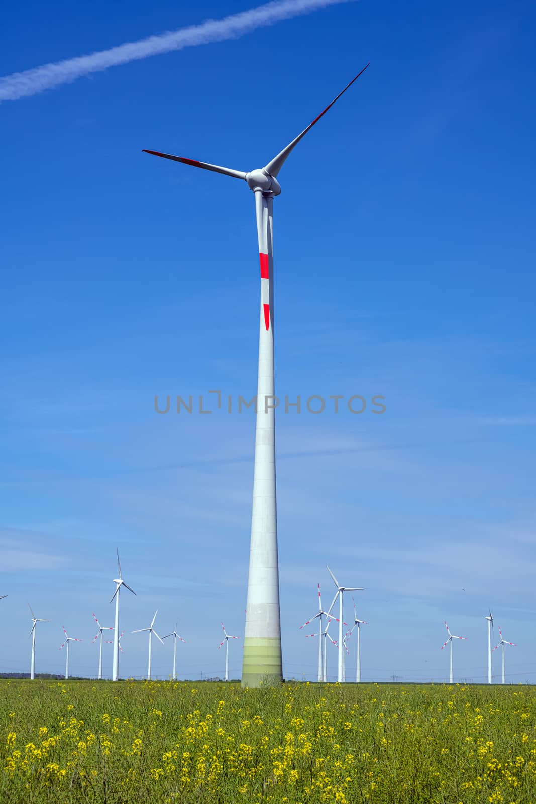 Modern wind power turbines seen in rural Germany
