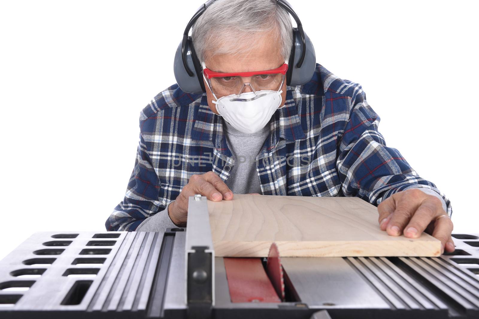 Woodworker Using a Table Saw. by sCukrov