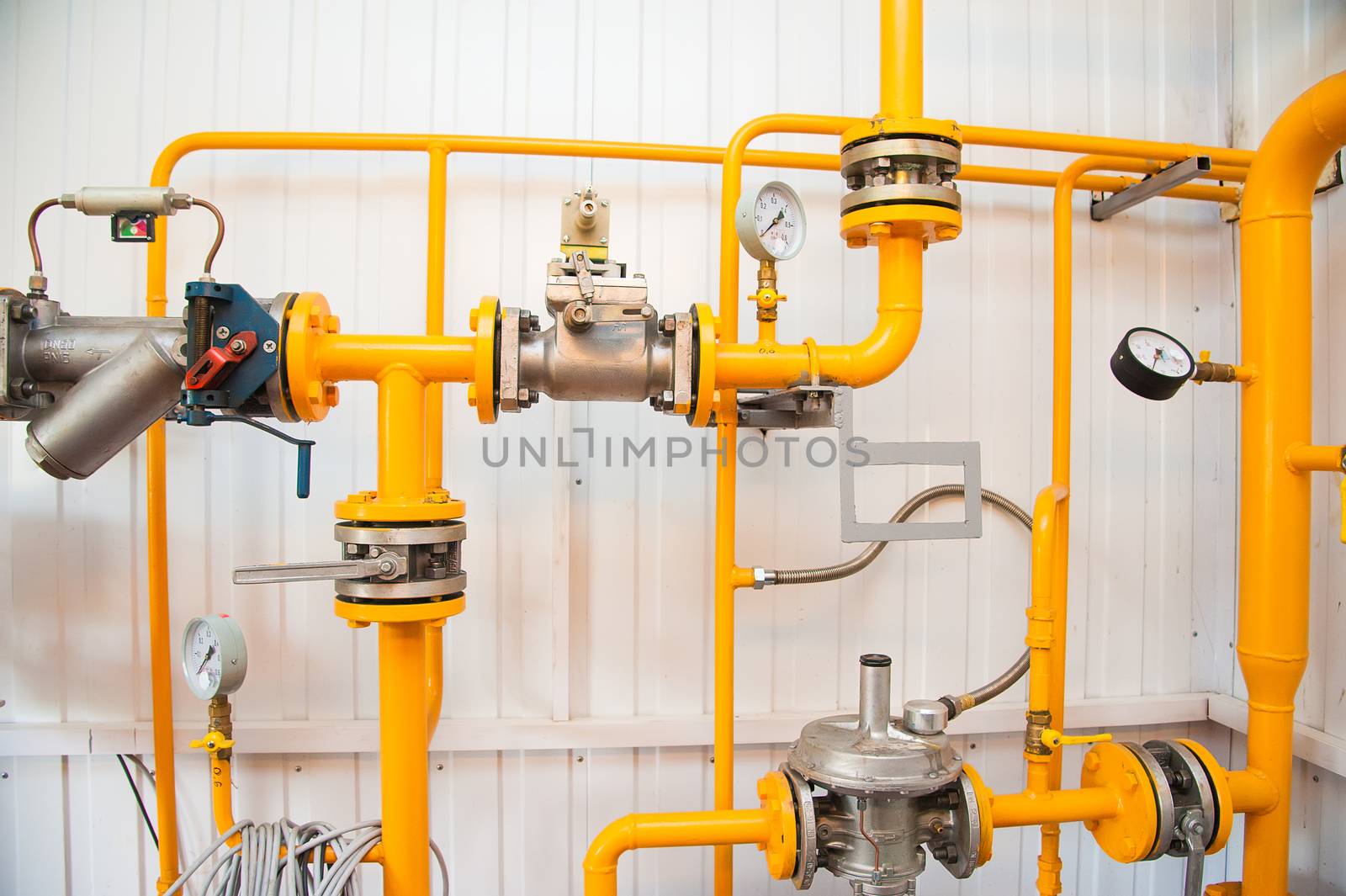 Modern boiler room equipment for heating system. Pipelines, water pump, valves, manometers