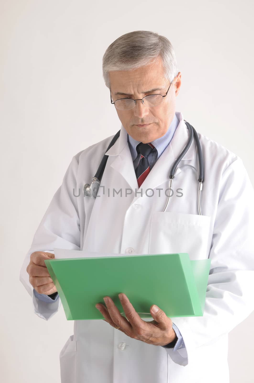 Doctor Holding Folder with Patients Chart by sCukrov
