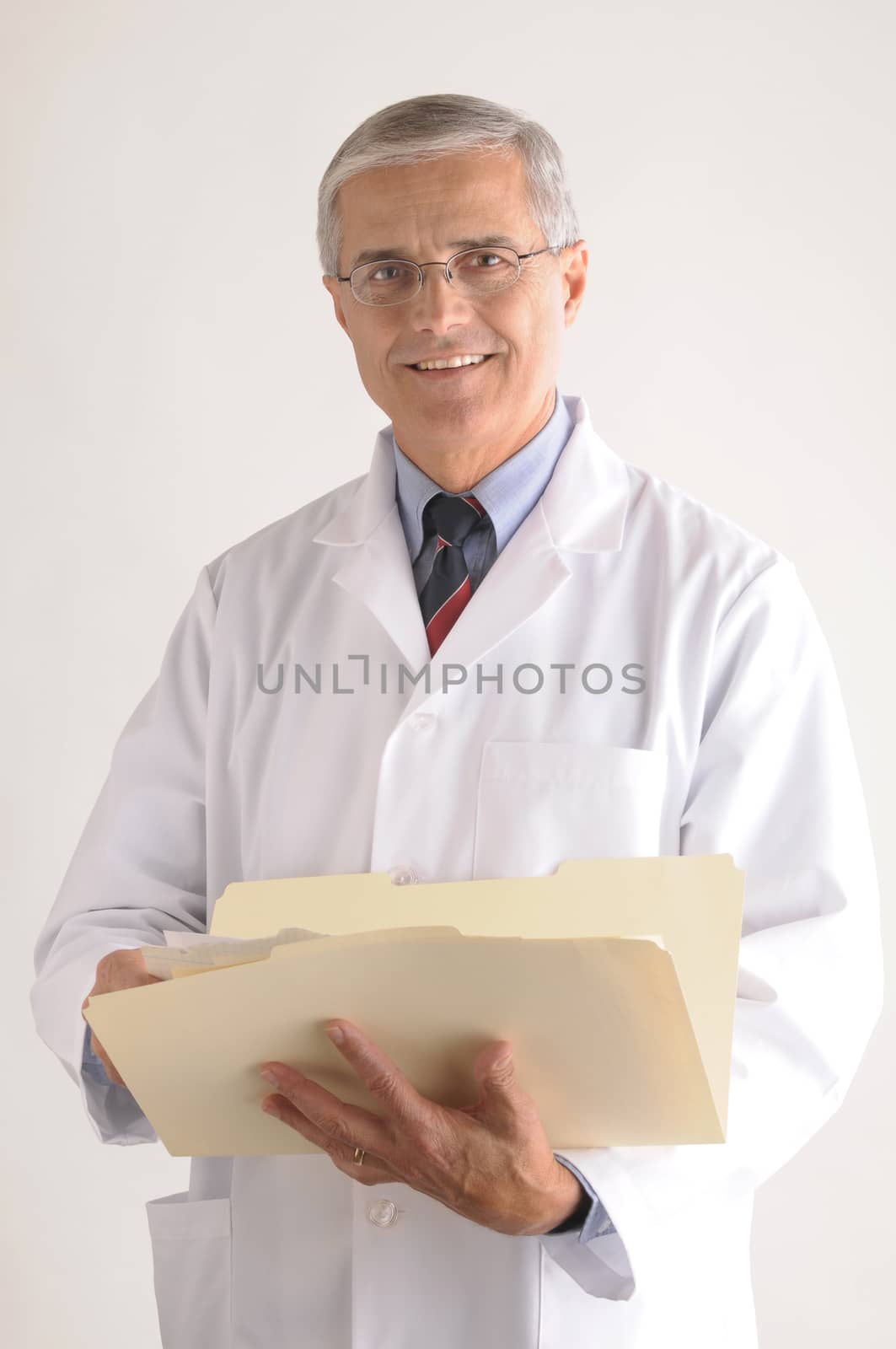 Doctor Holding Folder with Patients Chart by sCukrov