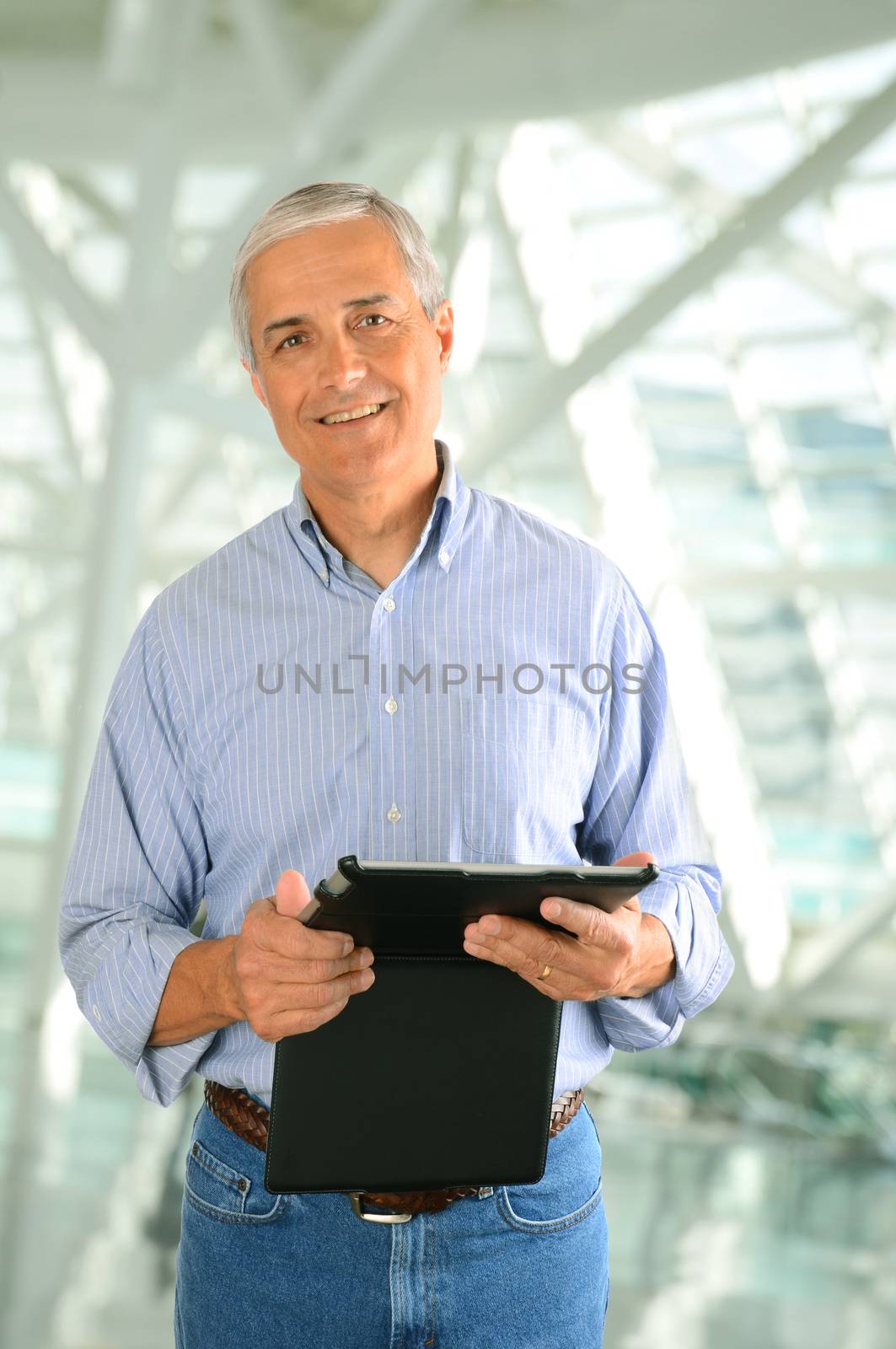 Businessman with Tablet Computer by sCukrov