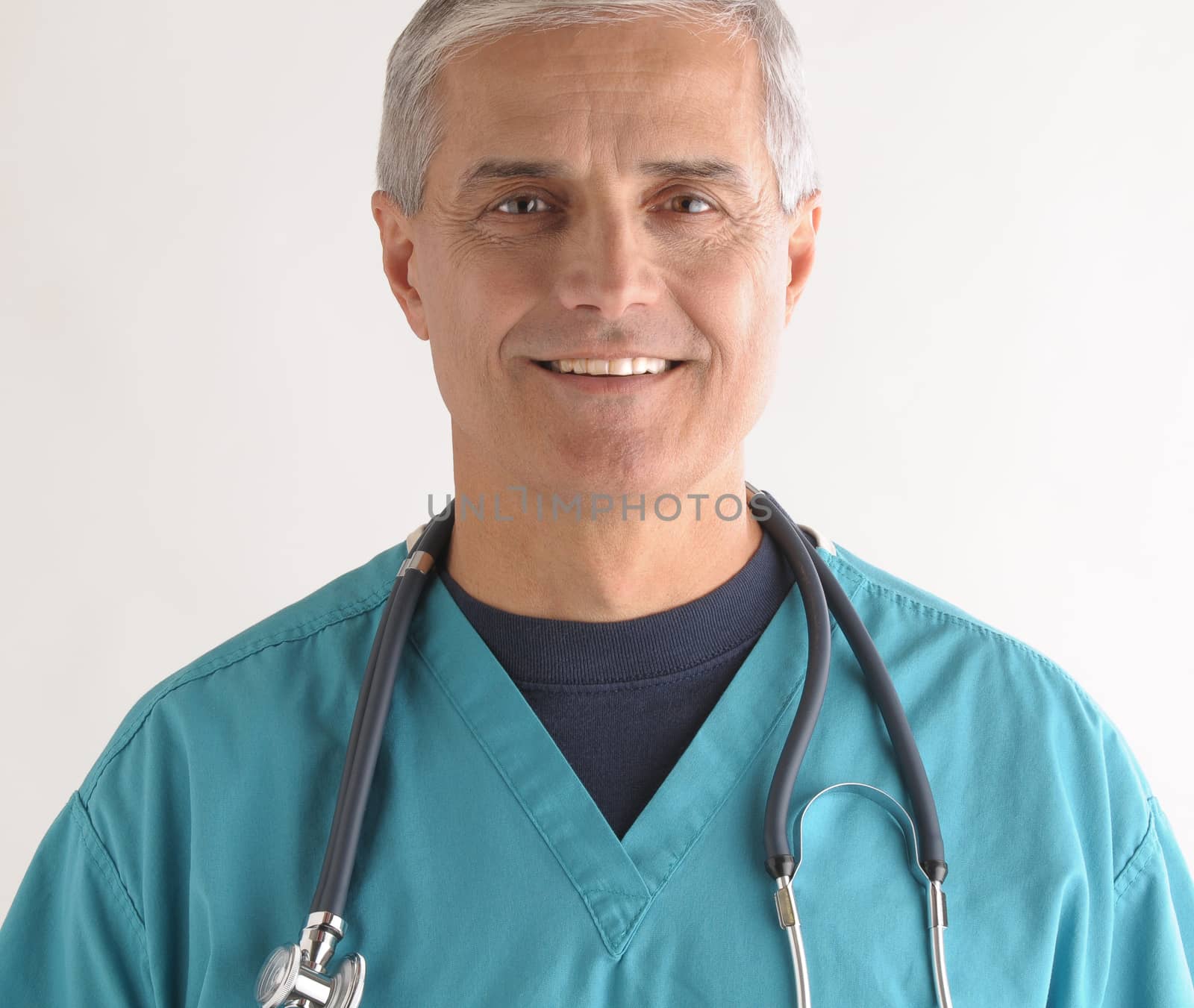 Close up of a Smiling Middle Aged  Doctor in Scrubs and Stethoscope square format