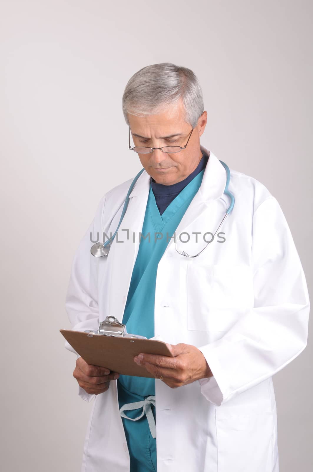 Doctor in Scrubs and Lab Coat with clipboard by sCukrov