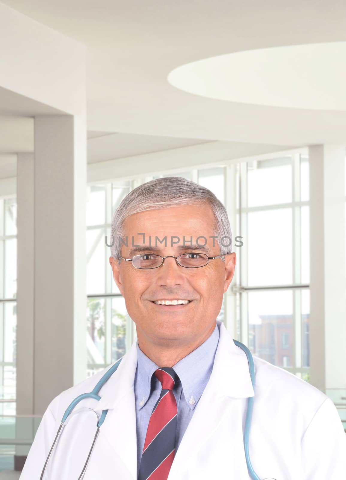 Portrait of a middle aged doctor in modern medical office setting