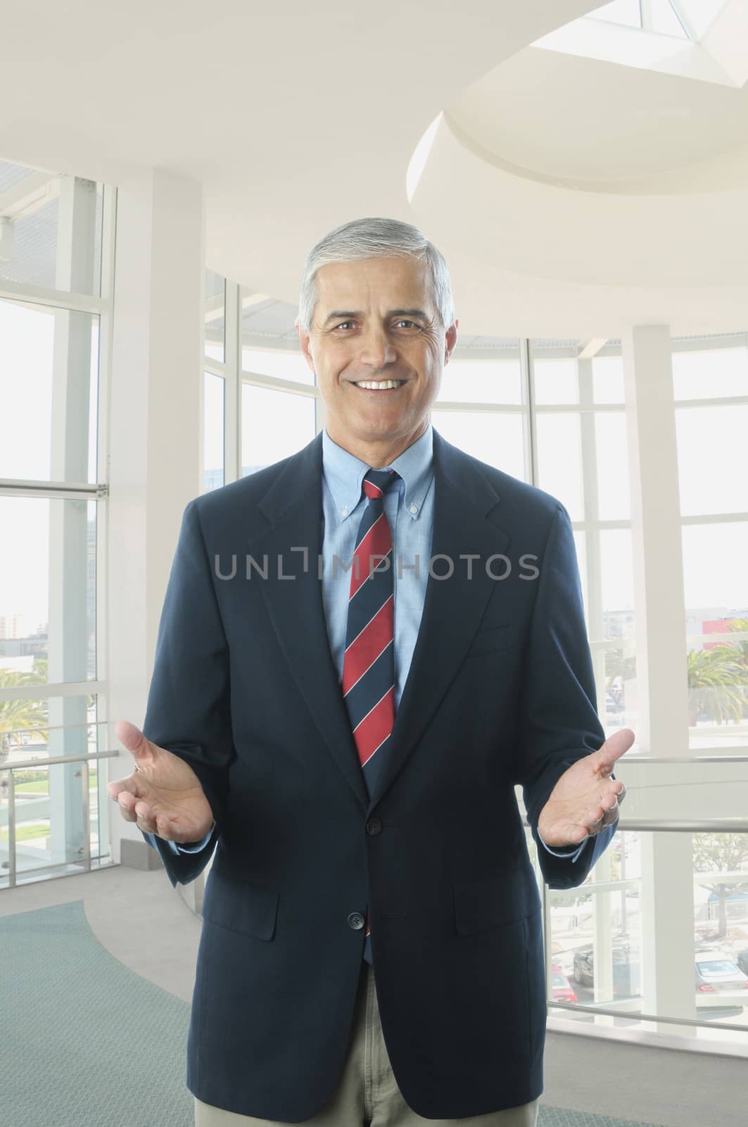 Middle aged Businessman in Blue Blazer Hands Extended by sCukrov