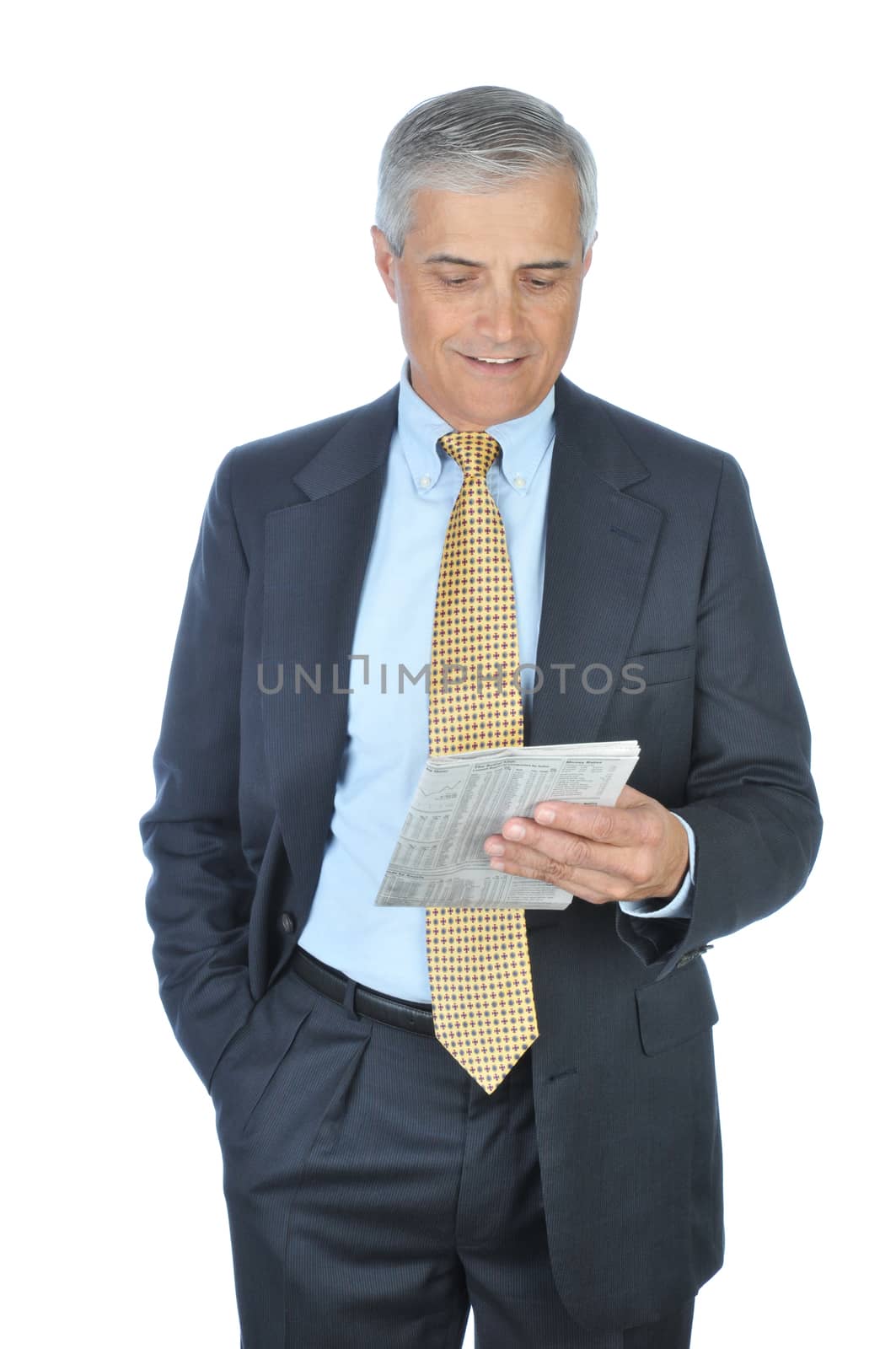 Businessman Standing Reading Newspaper with Hand in Pocket isolated on white