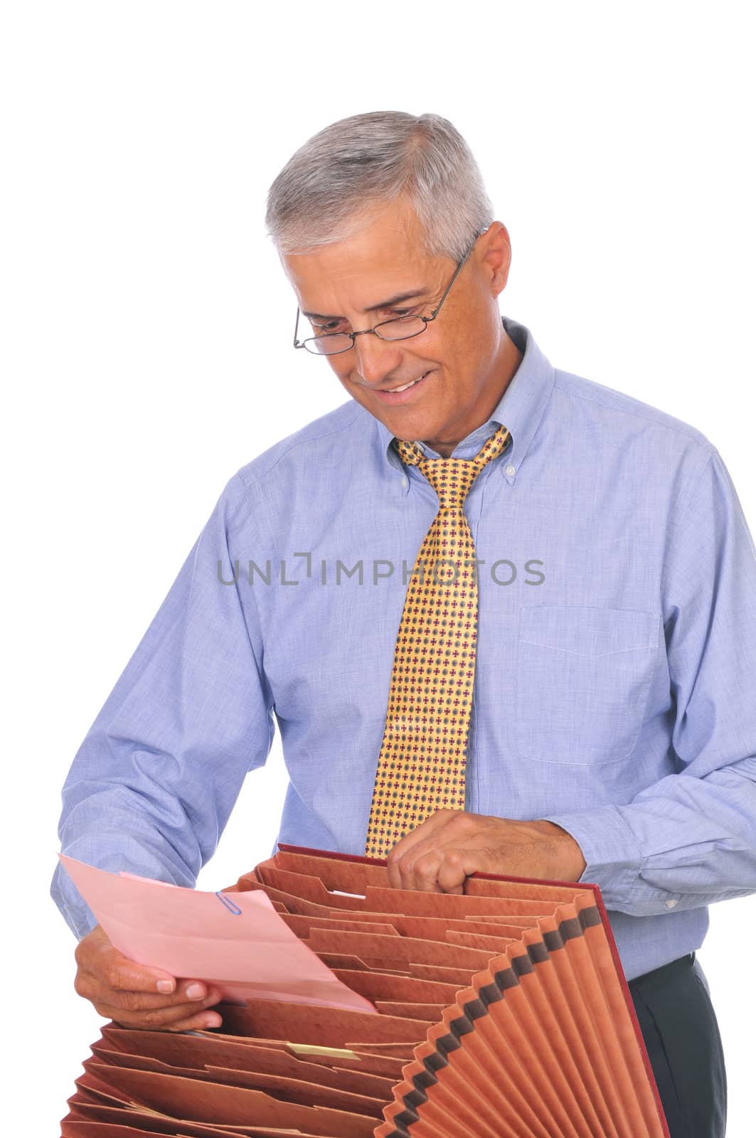 Smiling Businessman Putting Papers in File Box isolated on white