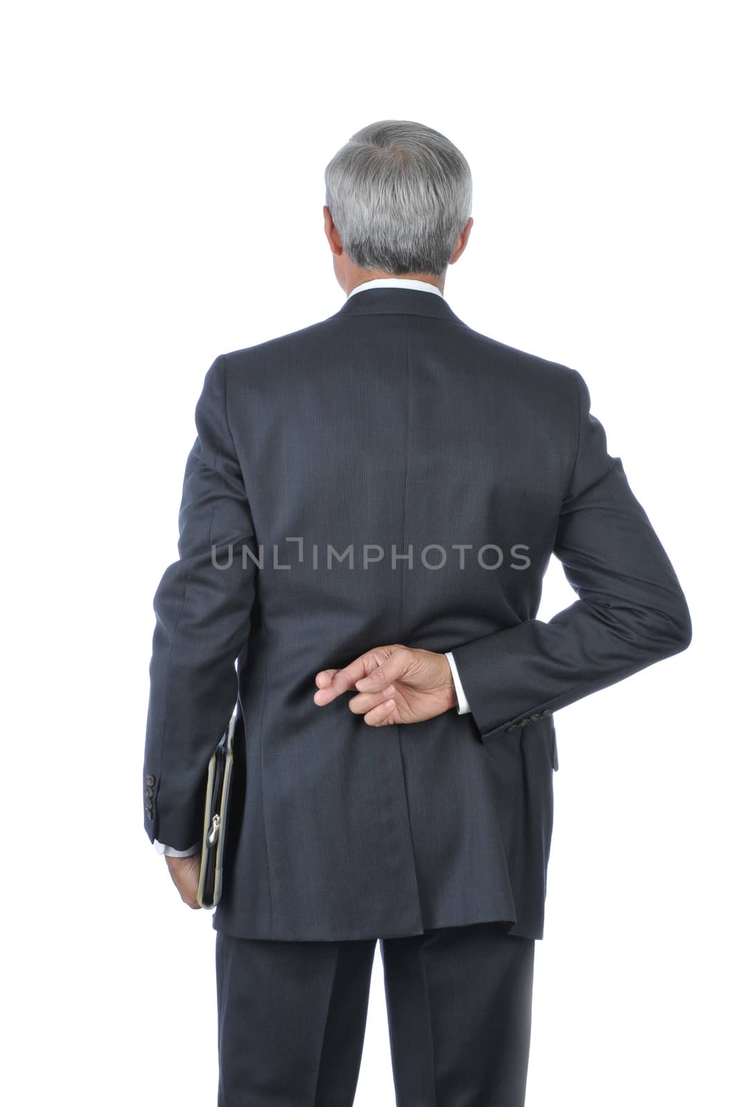 Standing Middle aged Businessman with fingers crossed behind back isolated on white