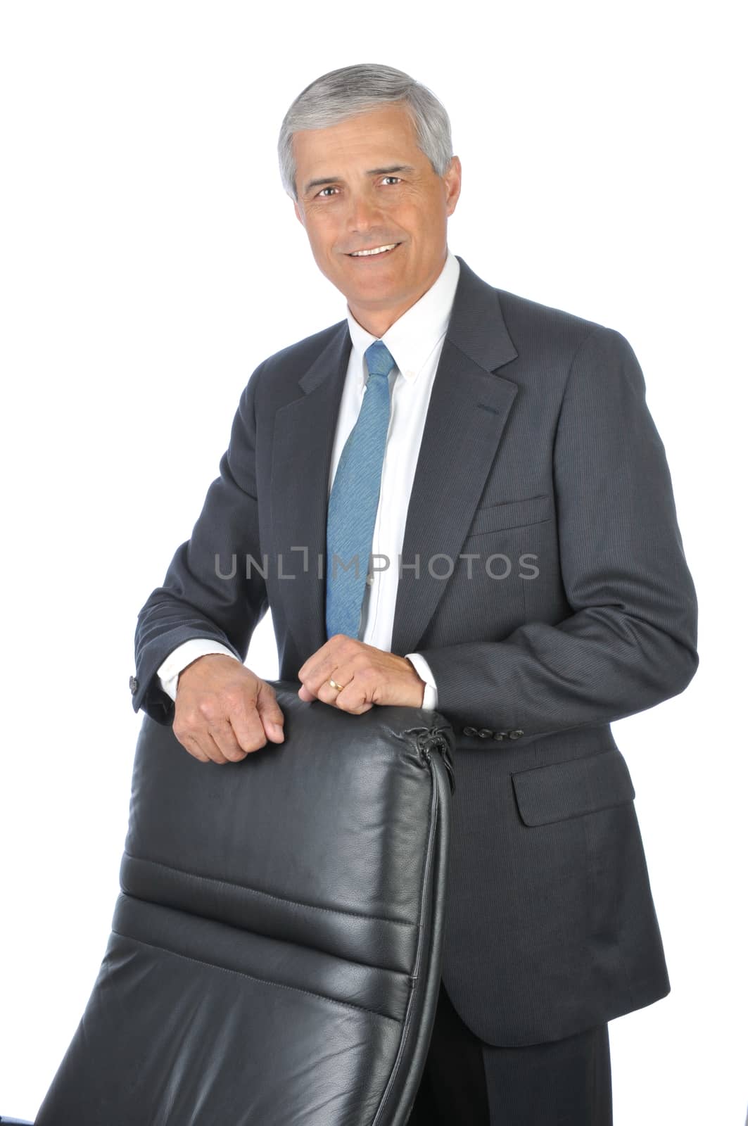 Businessman Standing behind His Chair isolated on white