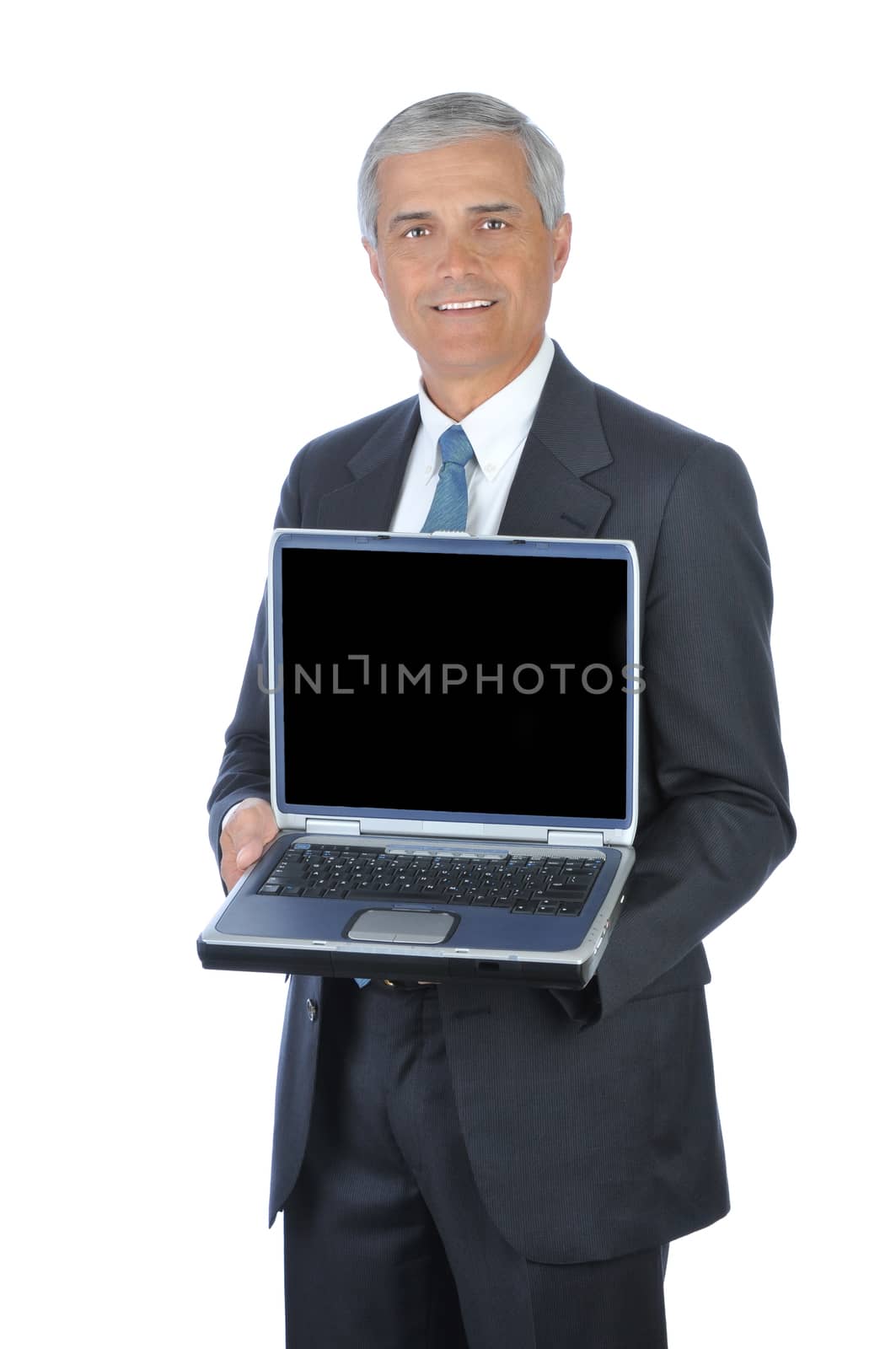 Smiling Businessman Holding an open Laptop Computer isolated on white