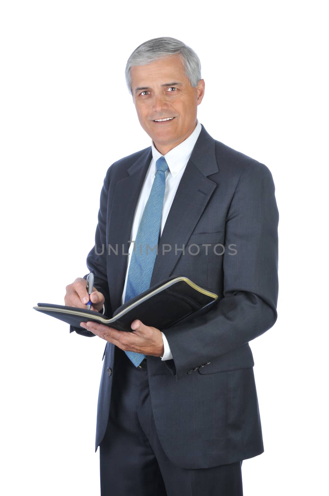 Smiling Businessman Writing in Notebook isolated on white