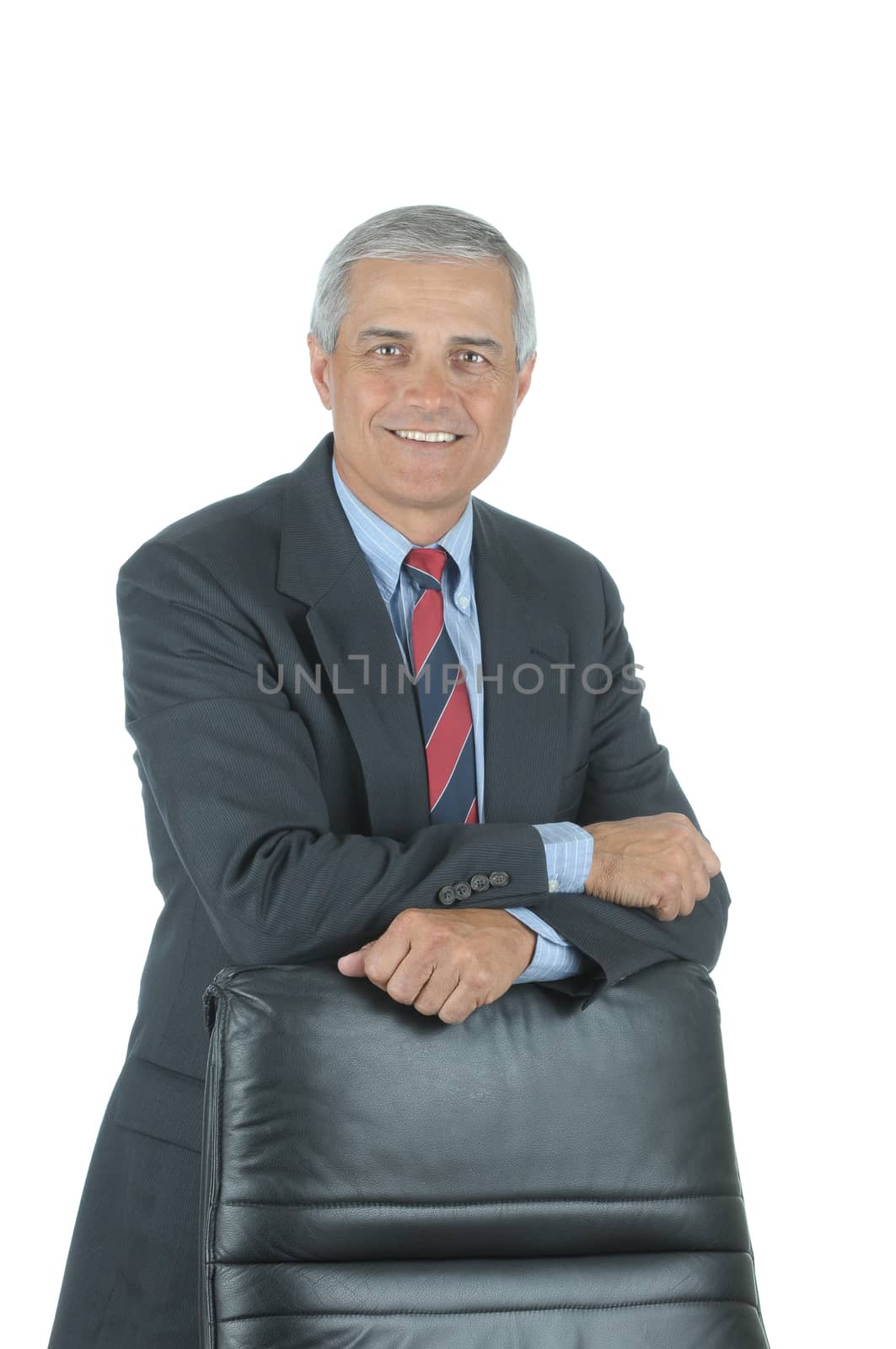 Smiling Middle Aged Businessman leaning on chair back isolated on white