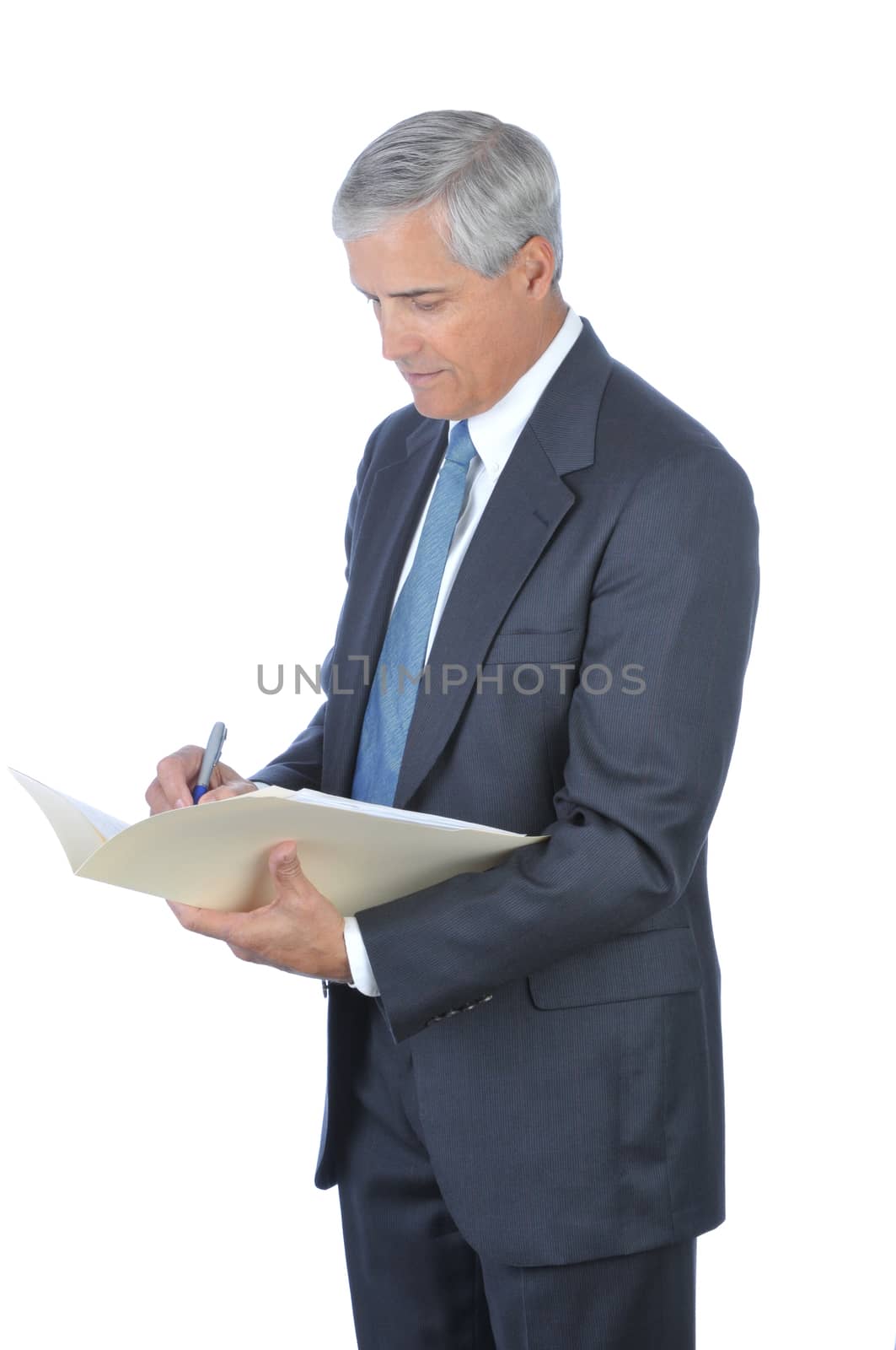 Middle Aged Businessman Writing in File Folder by sCukrov