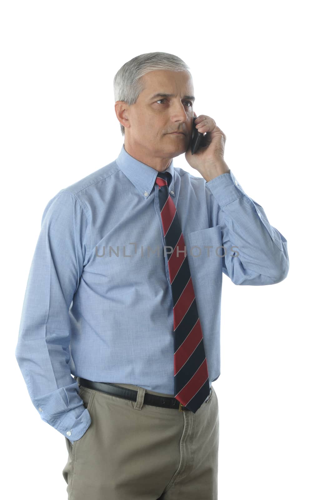 MIddle aged businessman talking on cell phone isolated over white vertical composition torso only