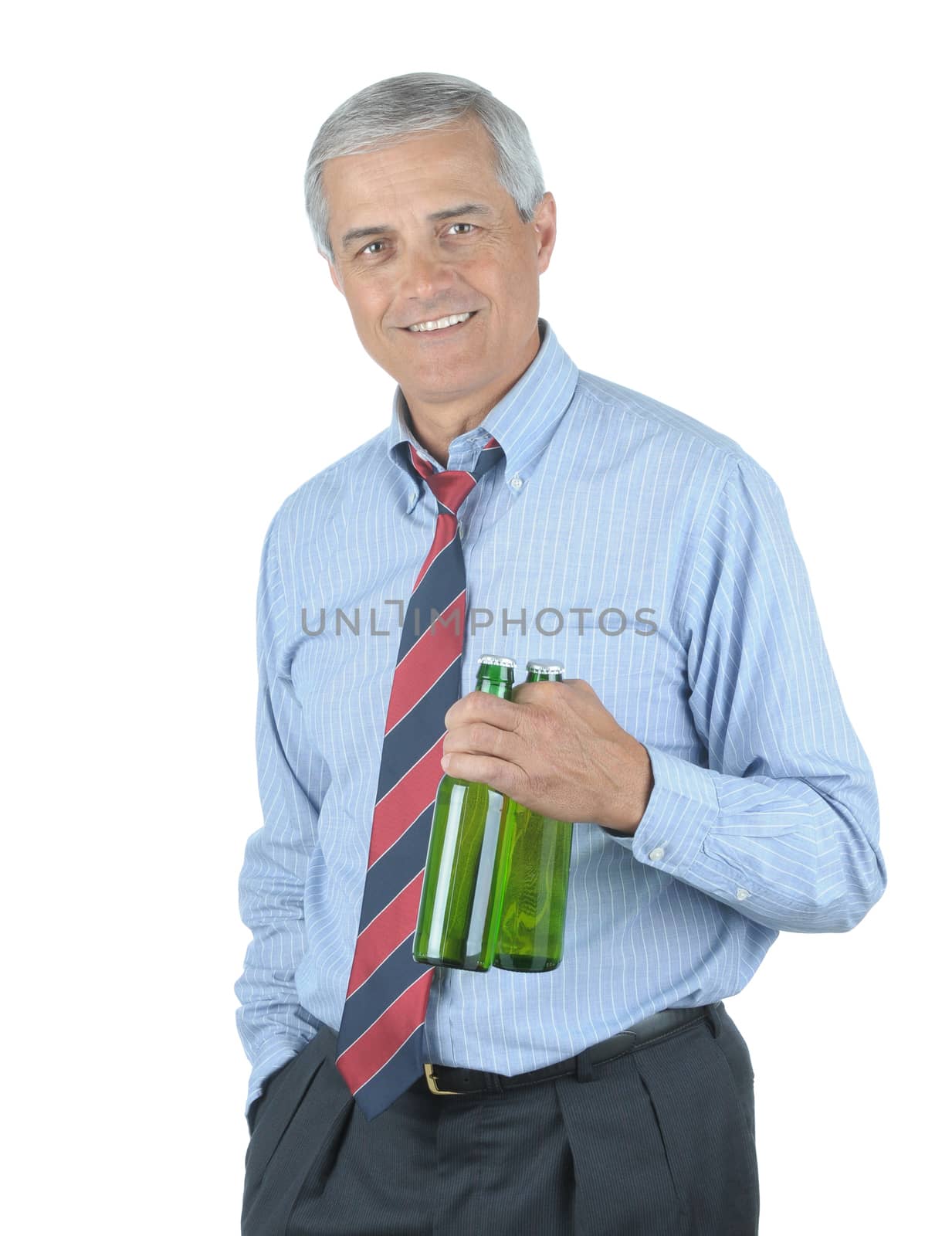 Middle aged businessman with tie undone holding two beers after a hard days work isolated over white