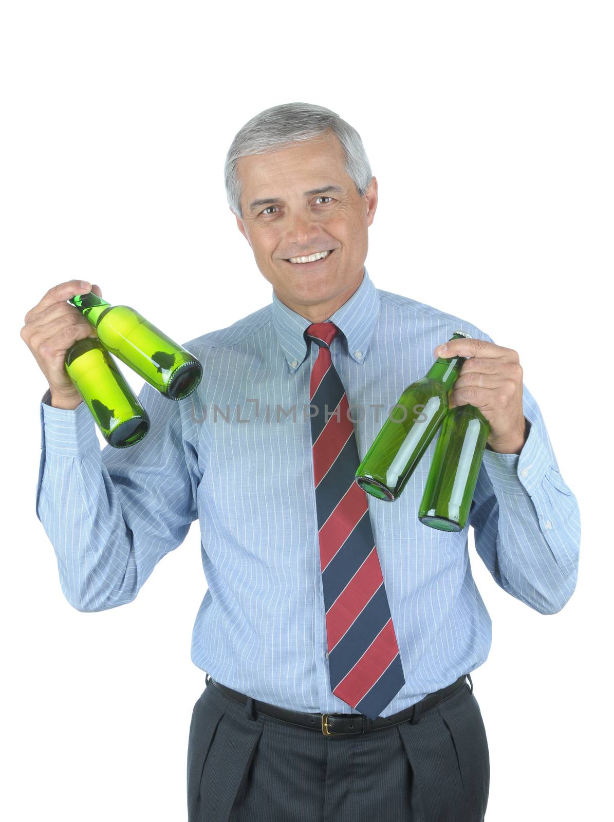 Middle aged businessman holding beer bottles in both hands after a hard days work isolated over white