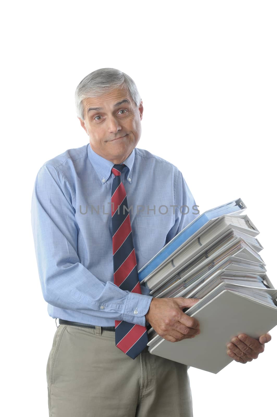 Overworked Businessman with frustrated expression Carrying a Large Stack of NoteBooks isolated over white vertical format torso only