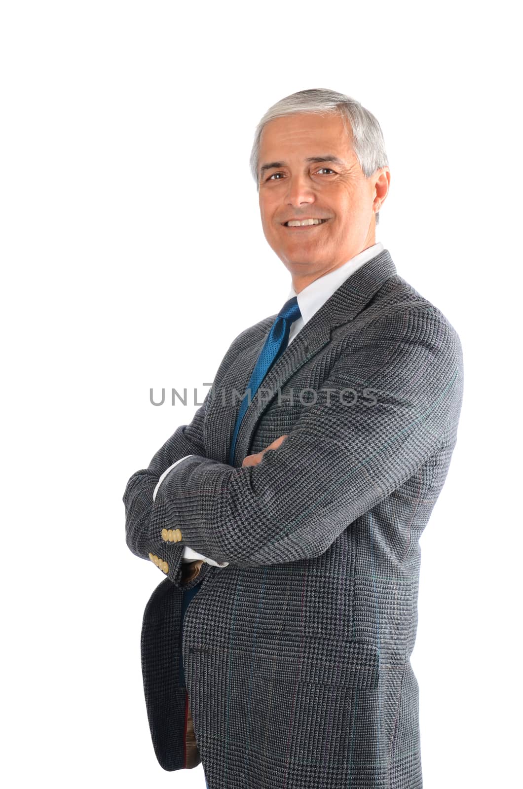 Portrait of a mature businessman with his arms folded isolated on a white background.