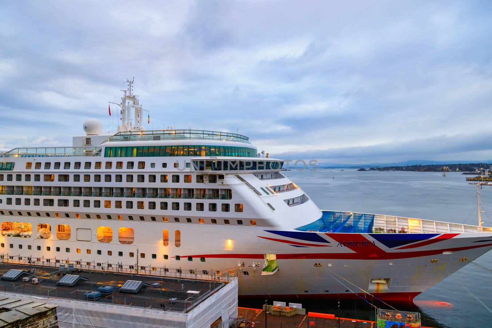 Norway, Oslo, CIRCA 2020: MV Aurora cruise ship of the P&O Cruises fleet docked in harbor due to covid19 restrictions. Concept of cruise ship stop due to coronavirus pandemic by dugulan