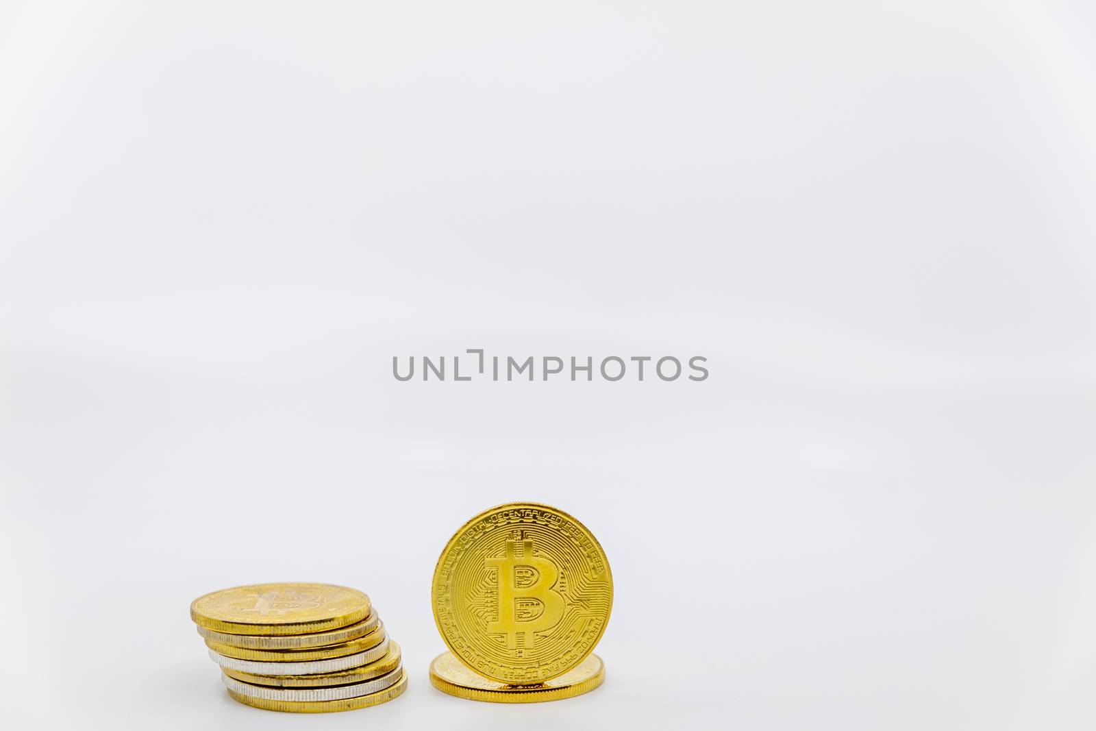 Stack of golden bitcoin tokens.Worldwide virtual internet cryptocurrency and digital payment system.Digital coin money crypto currency on bitcoin farm in digital cyberspace. Copy space.Negative space.