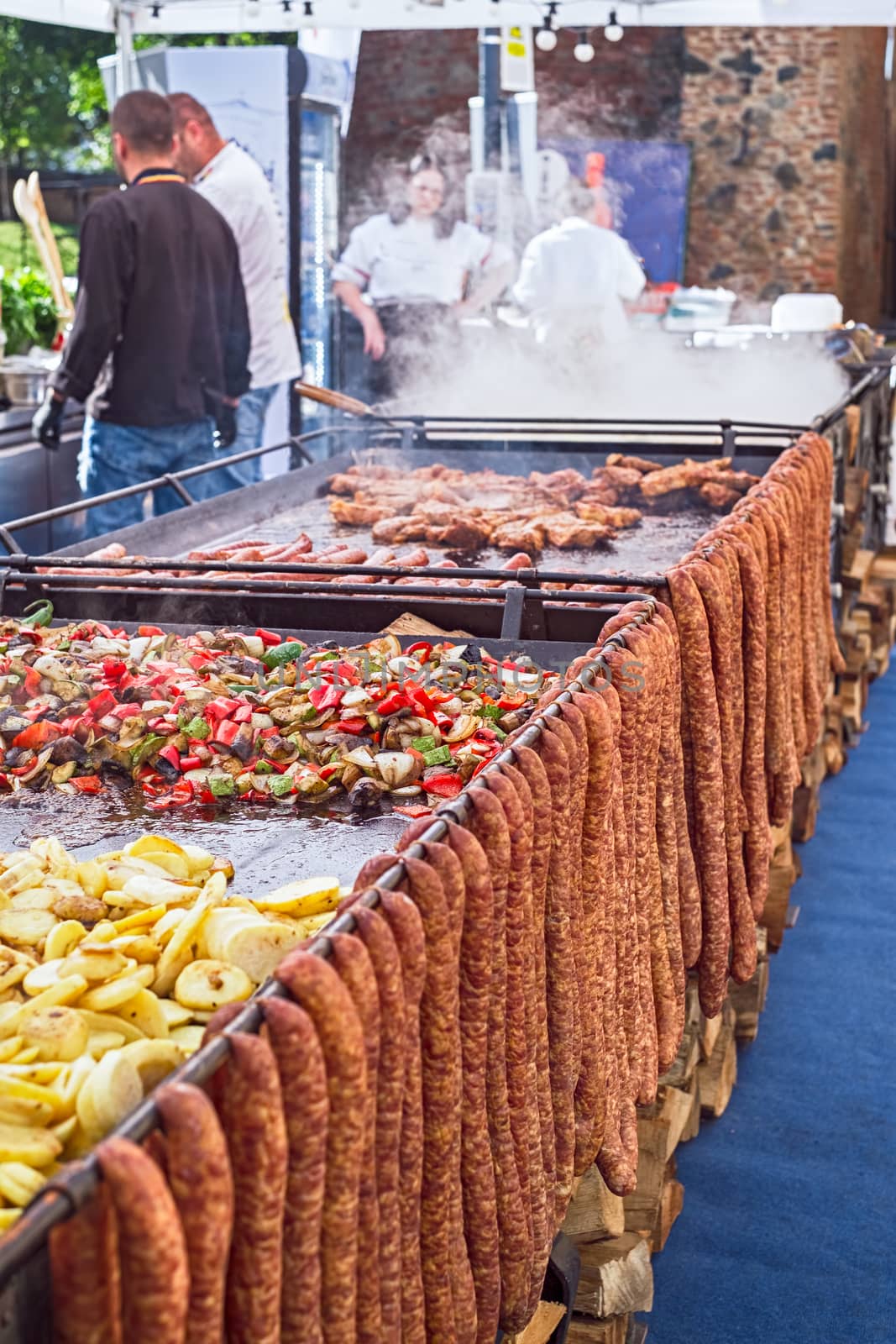 Sibiu, Romania - October 06, 2019. cooks preparing food at the Street food festival in Sibiu city in Romania