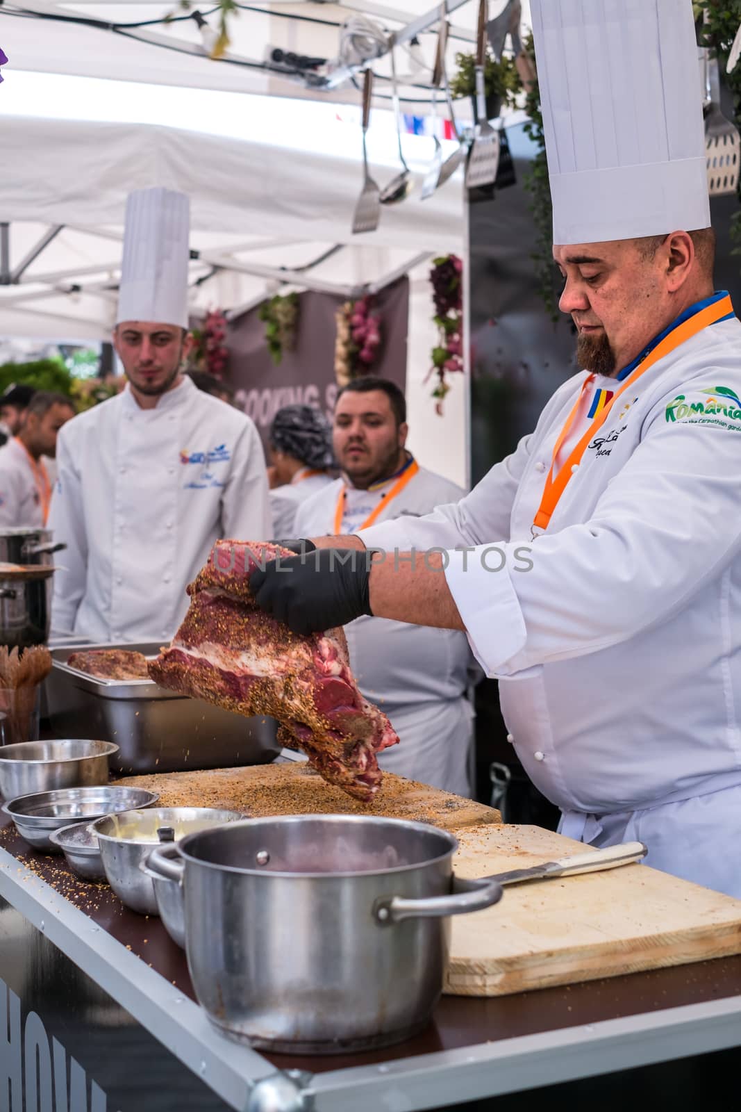 Sibiu City, Romania - 9 May 2019. Famous chef prepare a fresh piece Angus cattle of meat at the Summit of taste with the occasion of Informal meeting of heads of state or government 2019 in Sibiu, Romania