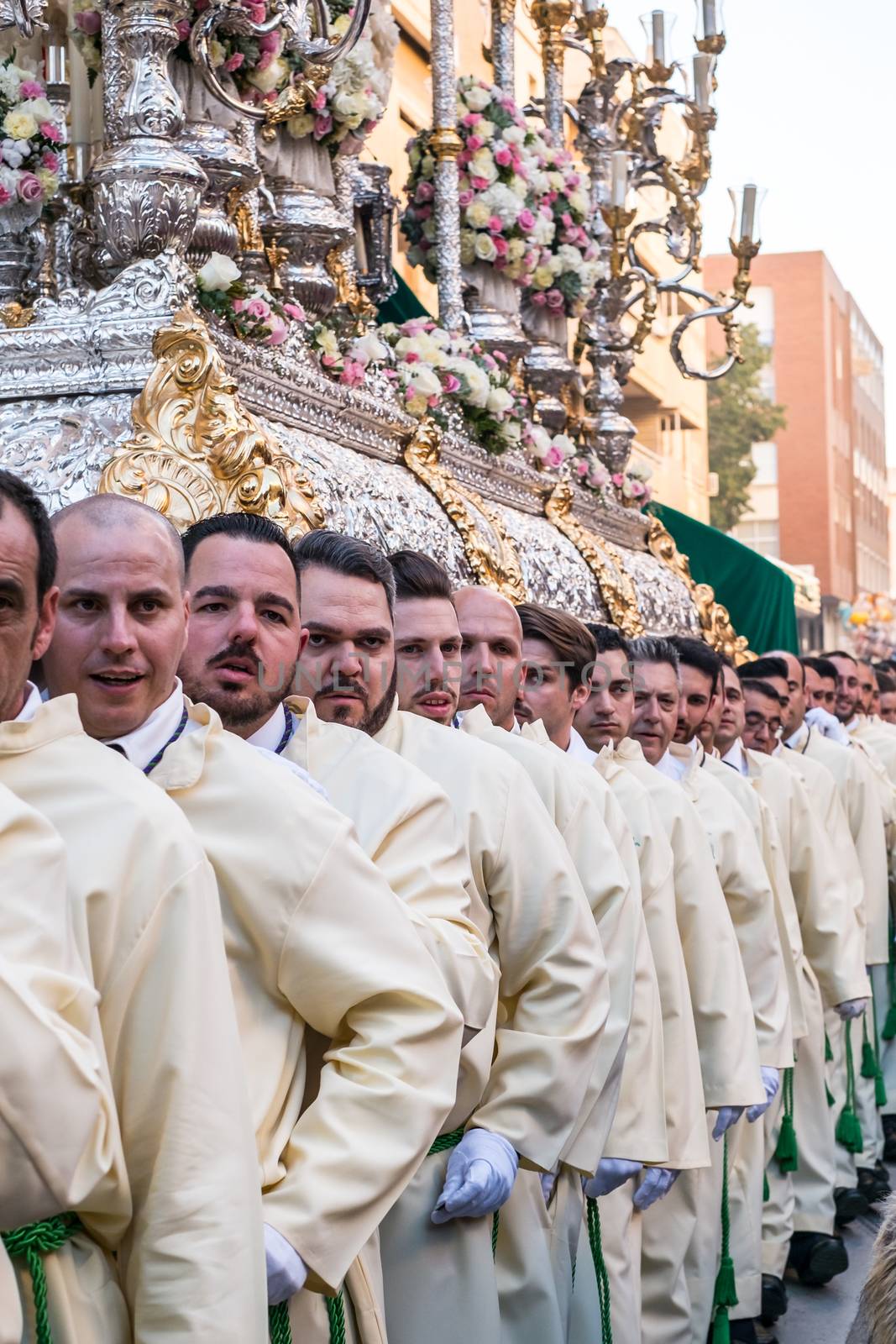 Malaga, Spain - March 27, 2018. People participating in the procession in the Holy Week in a Spanish city
