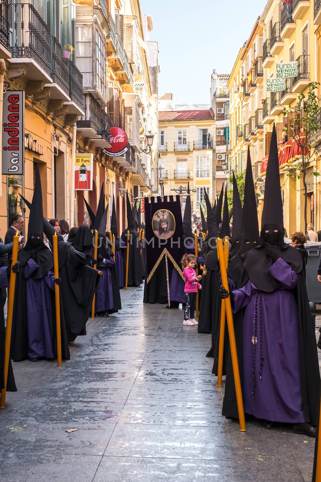 Malaga, Spain - March 26, 2018. People participating in the procession in the Holy Week in a Spanish city