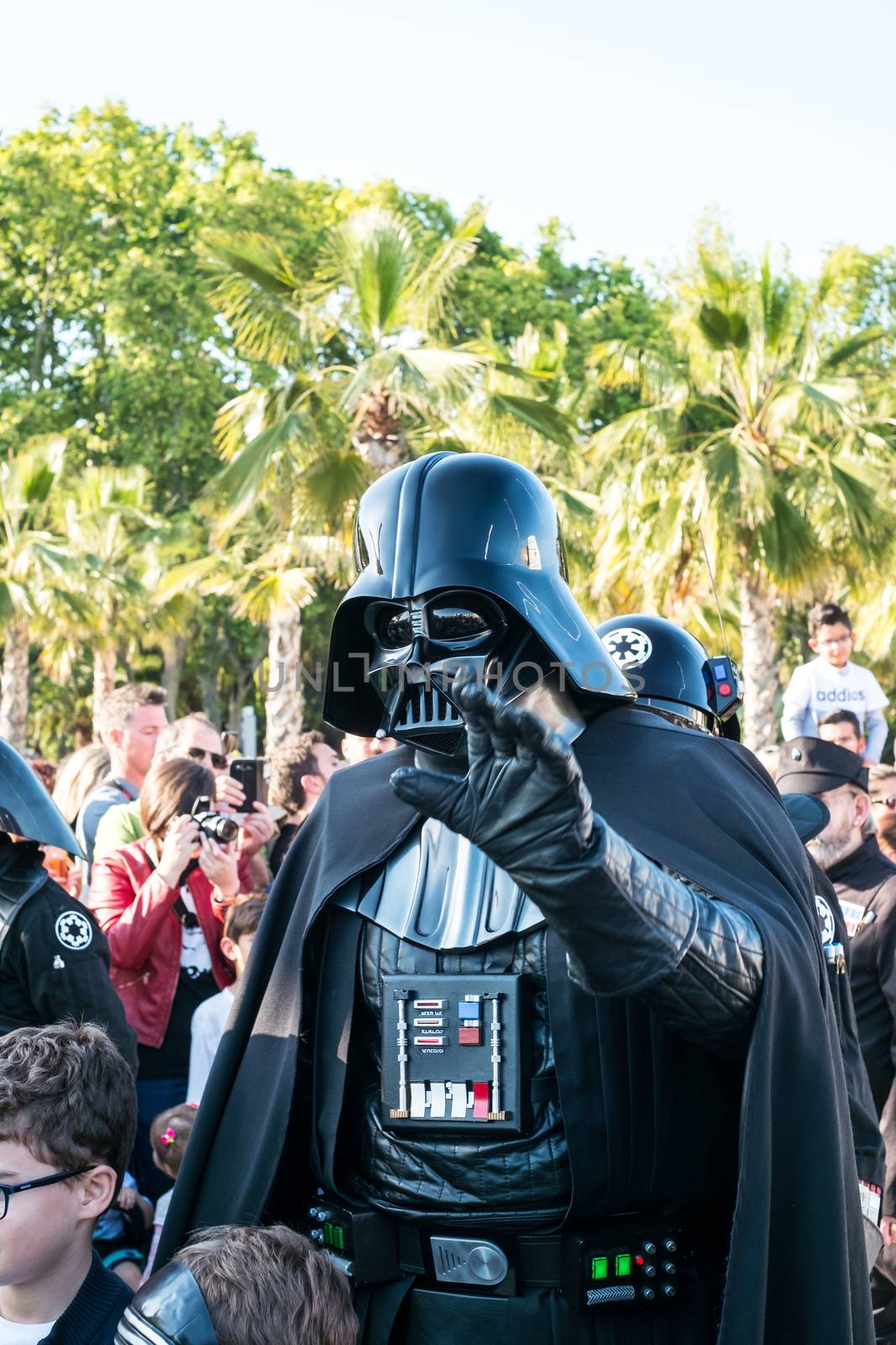 Malaga, Spain - May 05, 2018. Member of the 501st Legion Spanish Garrison dressed as Darth Vader from the movie saga Star Wars, perform along the walk Muelle Uno, Malaga, Spain